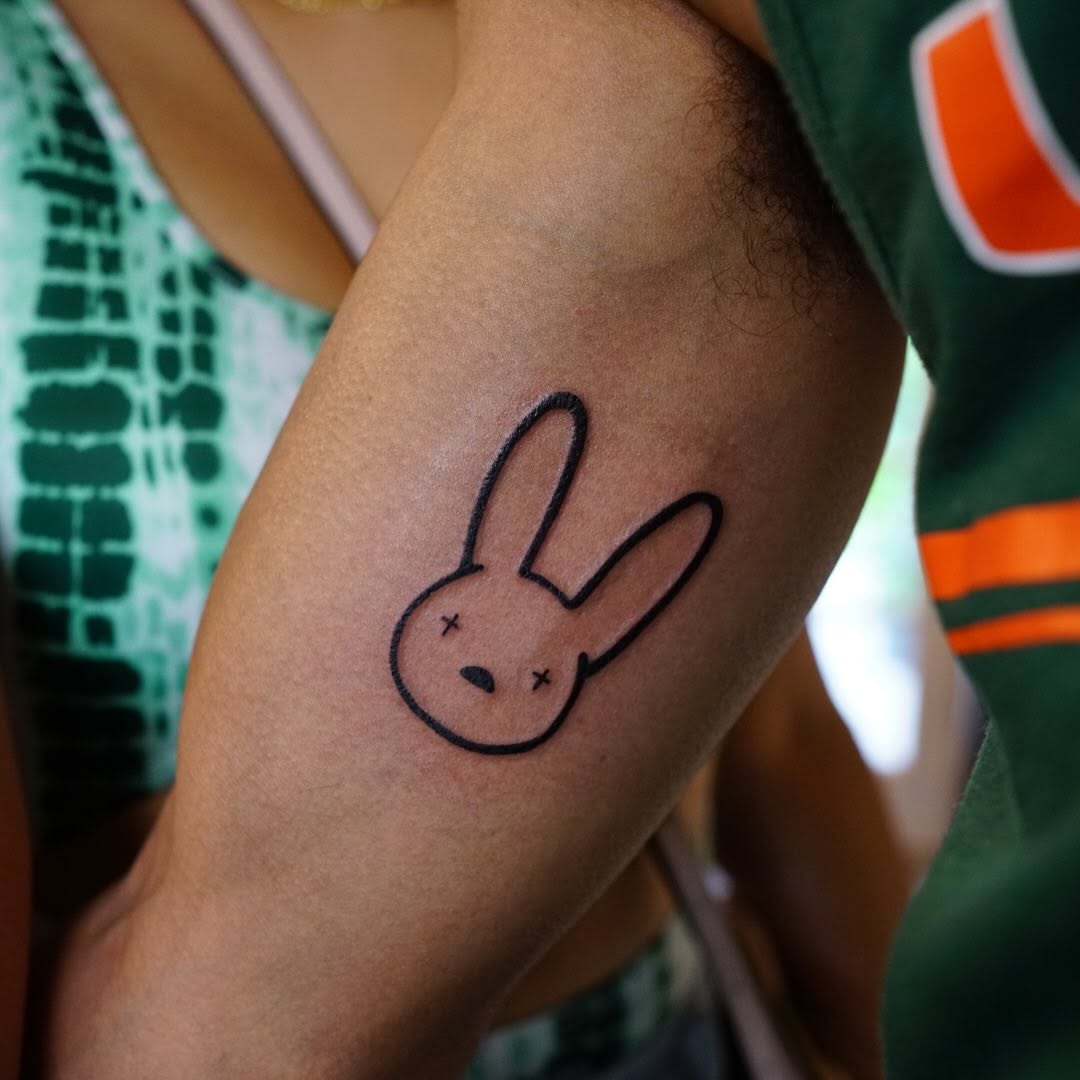 Bunny face new school tattoo on the forearm by chloe.mari_ink