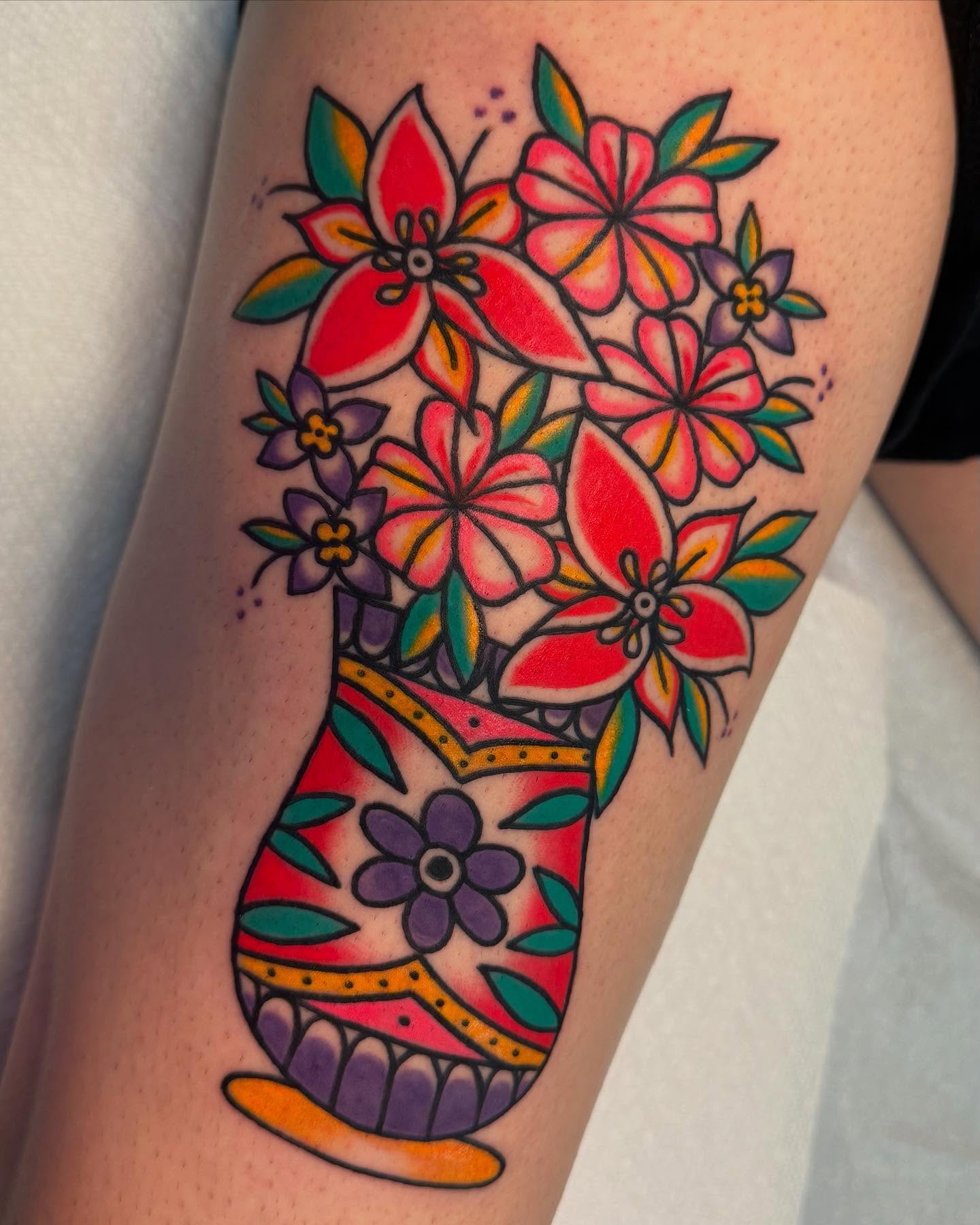 Flower bouquet new school tattoo on the thigh by Shana