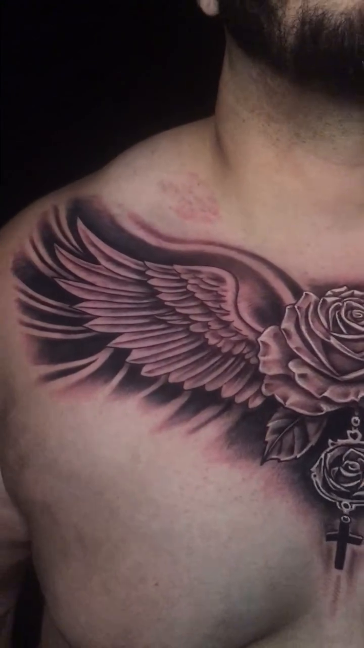Rose with wings and cross realism tattoo by Jose Calderon