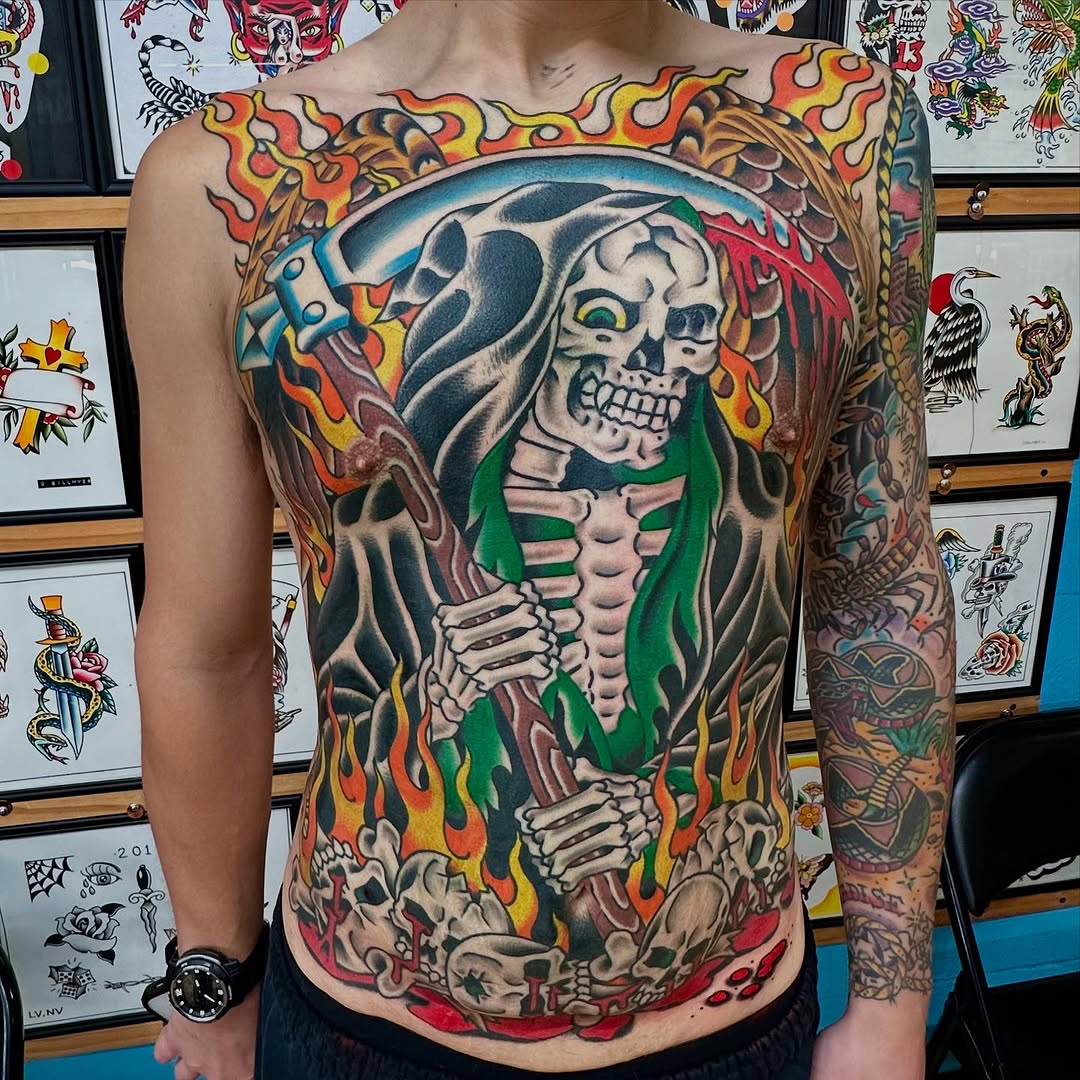 Grim reaper with scythe and skulls American traditional tattoo on the back by Max mogstad
