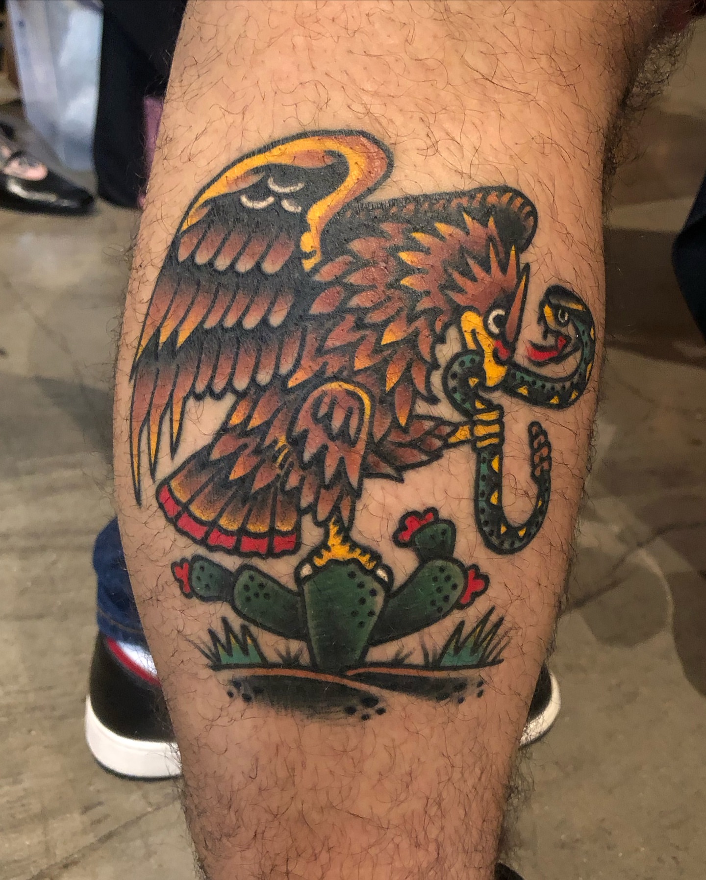 Eagle and cactus American traditional tattoo on the thigh by Nick Sharratt, Chicago, Illinois