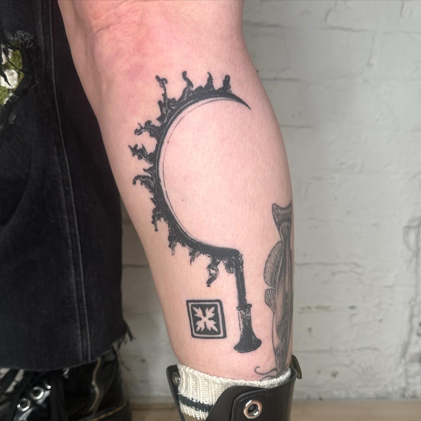Key and moon black and grey tattoo on the forearm by πΈππππππ