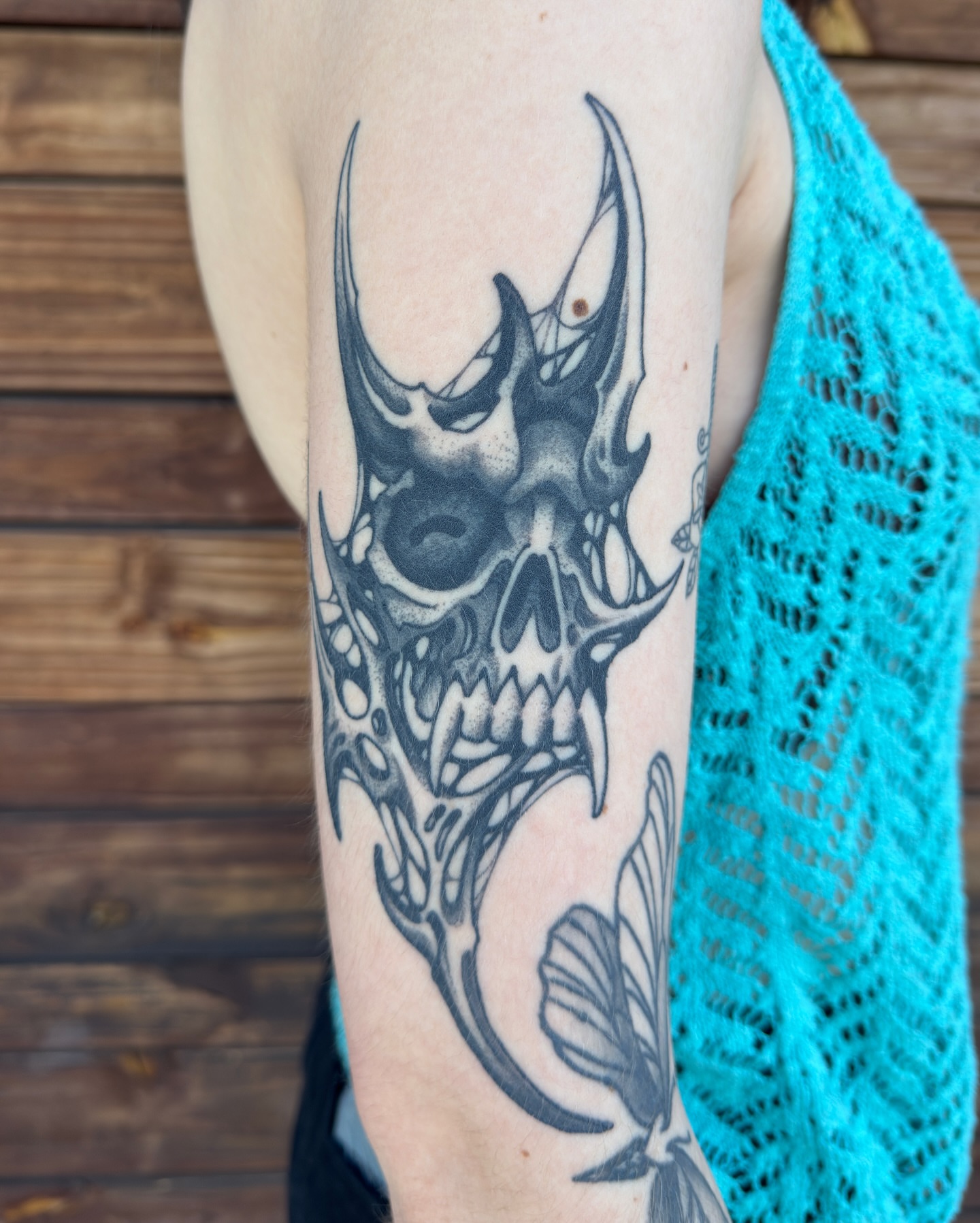 Skull black and grey tattoo on the forearm by Scott Kulikowski