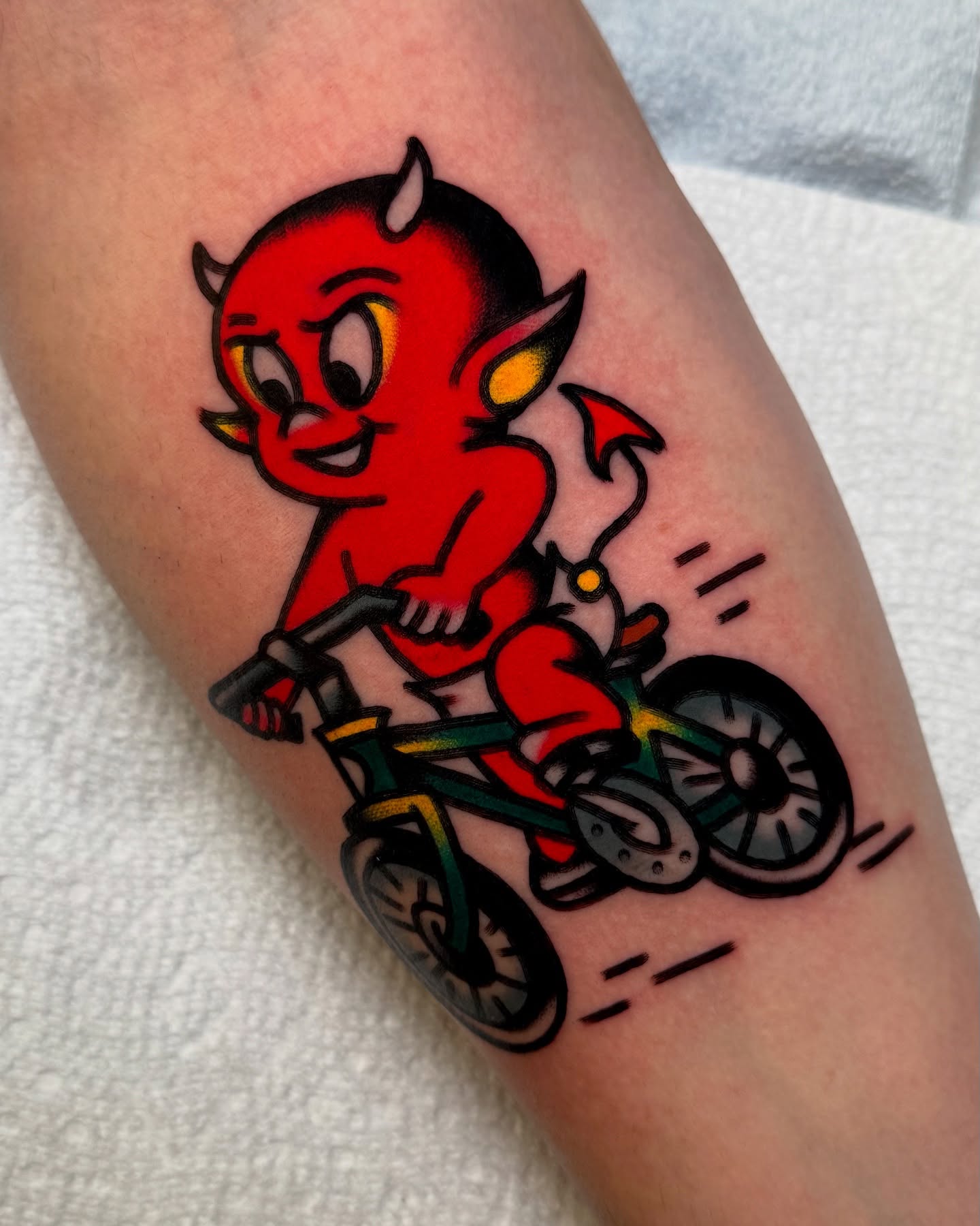 Devil riding bike American traditional tattoo on the forearm by Zachary - Traditional Tattoo Artist