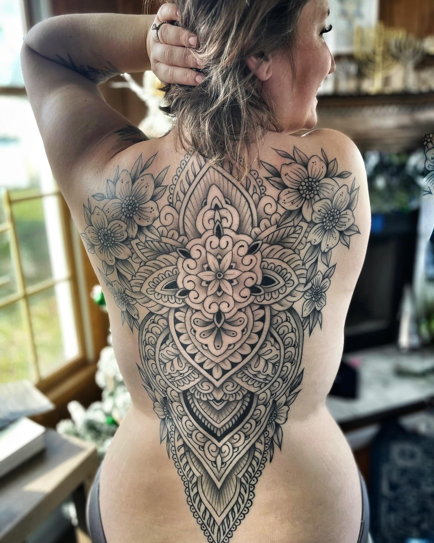 Mandala ornamental tattoo on the back by Dave Kruseman