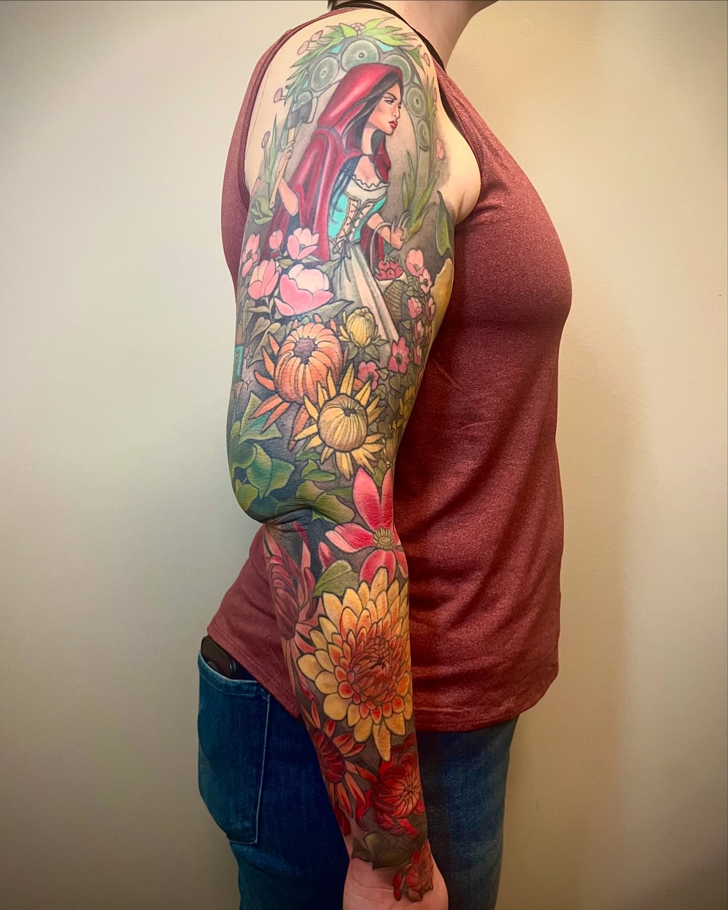 Floral fantasy illustrative tattoo on the upper arm by Jessica Brown