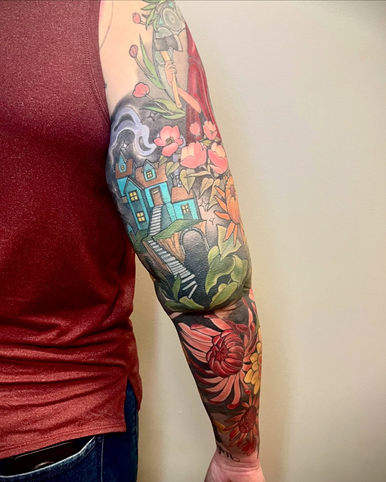 Houses and flowers new school tattoo on the forearm by Jessica Brown