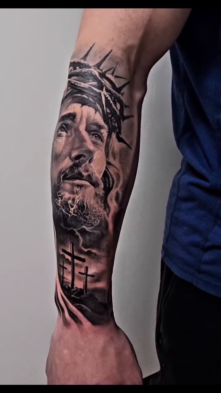 Jesus Christ with crown of thorns realism tattoo by Tyler Malek
