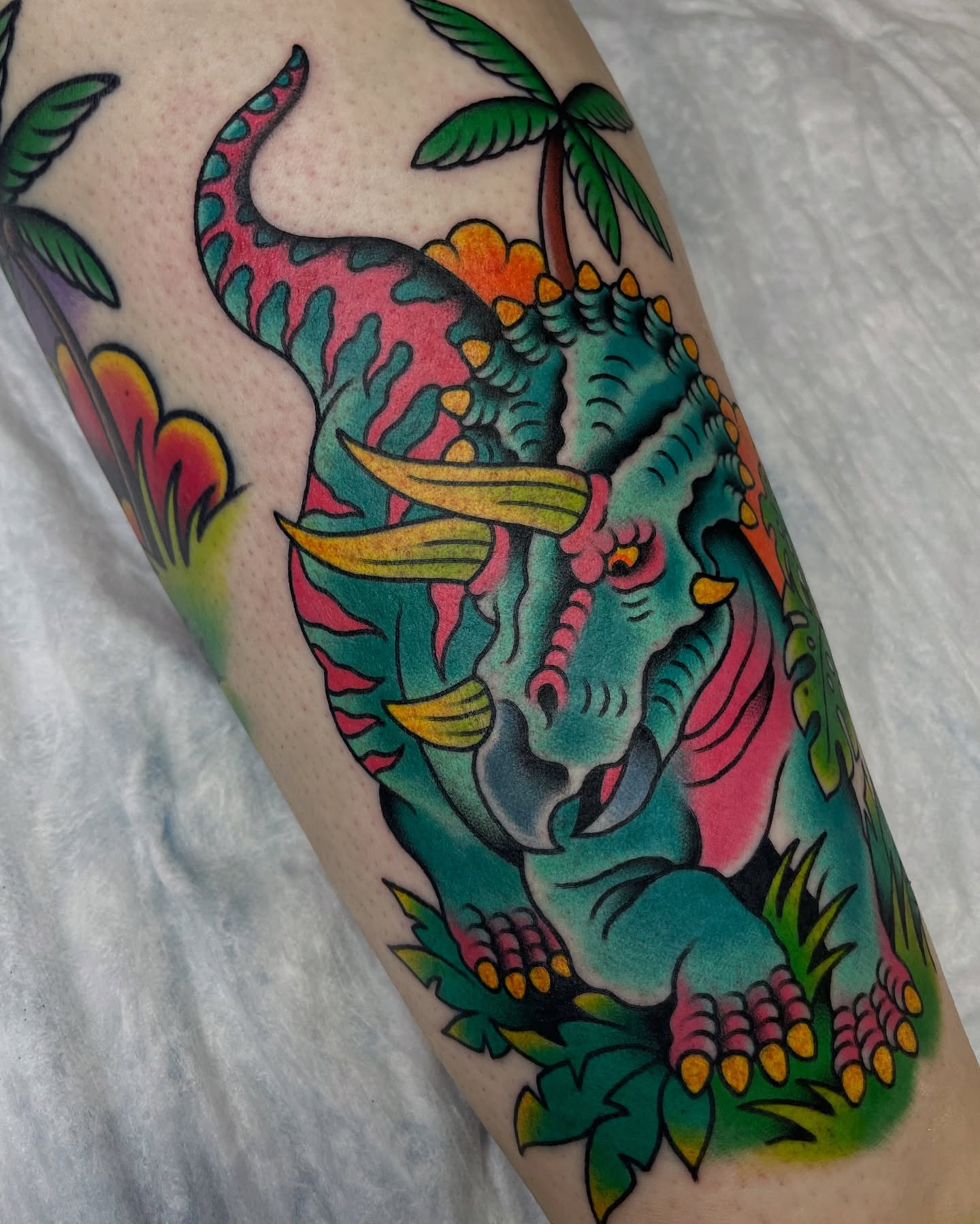 Triceratops American traditional tattoo on the forearm by Tom Taylor, Philadelphia, Pennsylvania