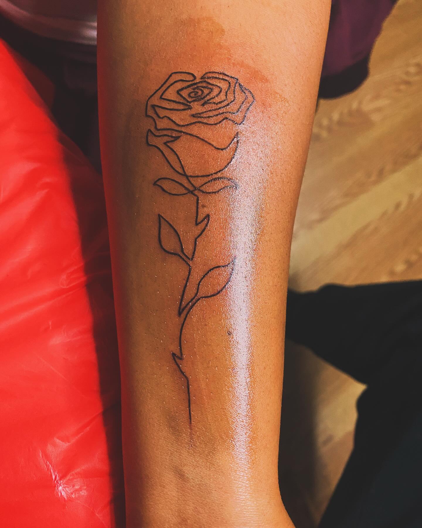Rose fine line tattoo on the forearm by Detroit tattoo Artist