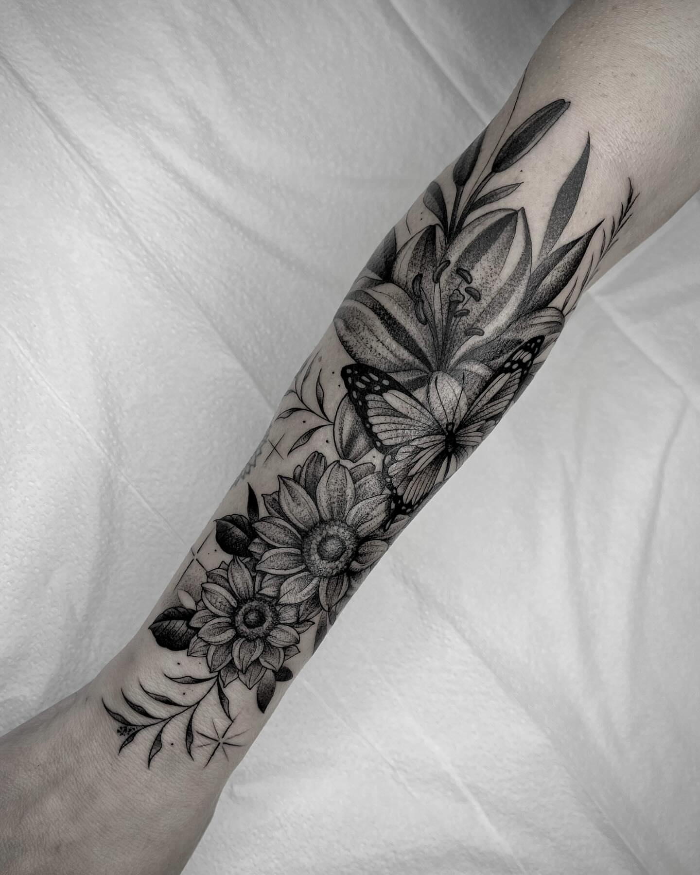 Flowers and butterflies realism tattoo on the forearm by Martha Gual π€ East ATX Tattooer