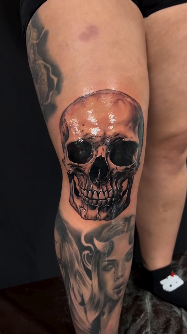 Skull and portrait realism tattoo by Thomas Conard