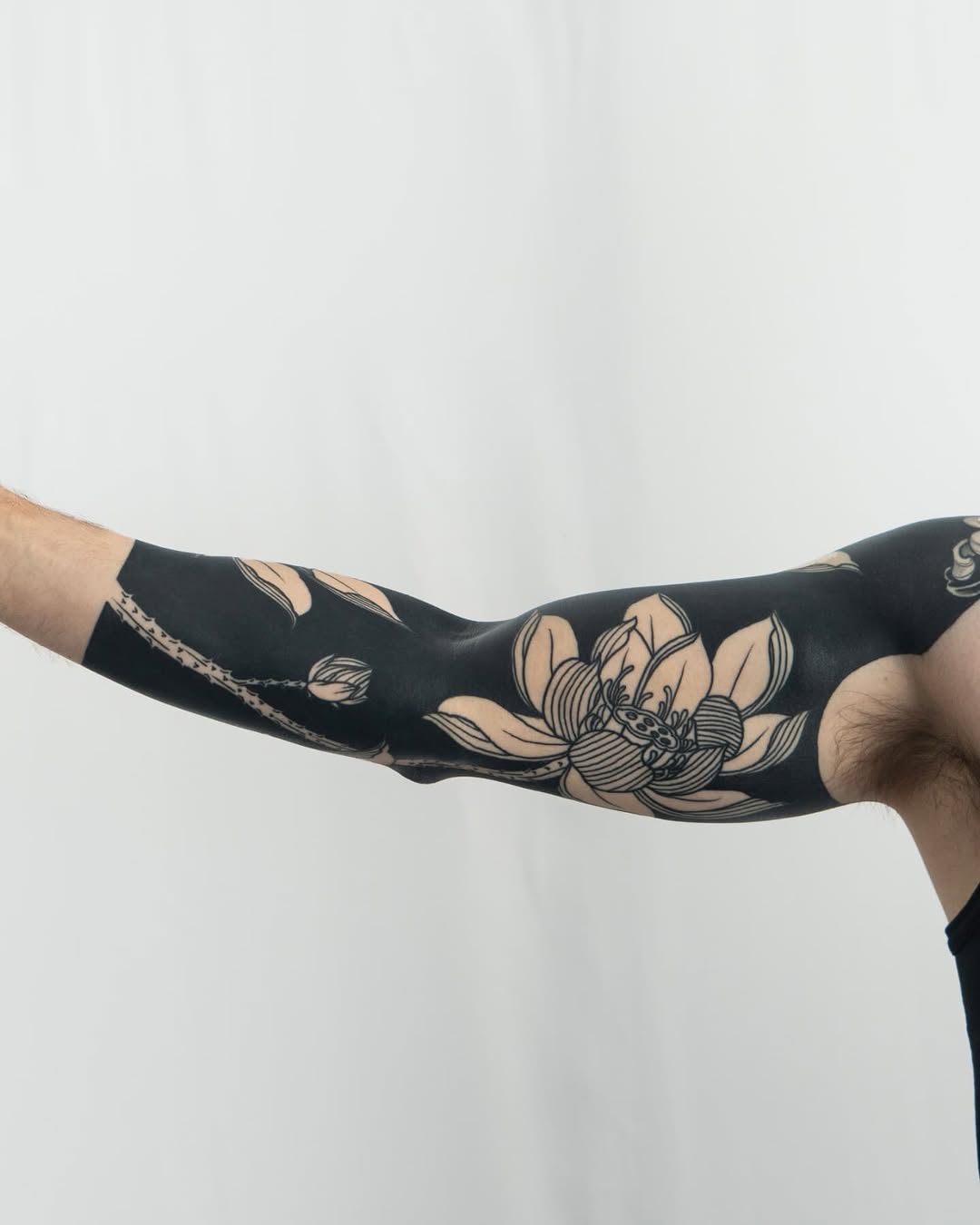 Lotus flower with beetle Japanese tattoo on the forearm by Kevin Ligabue