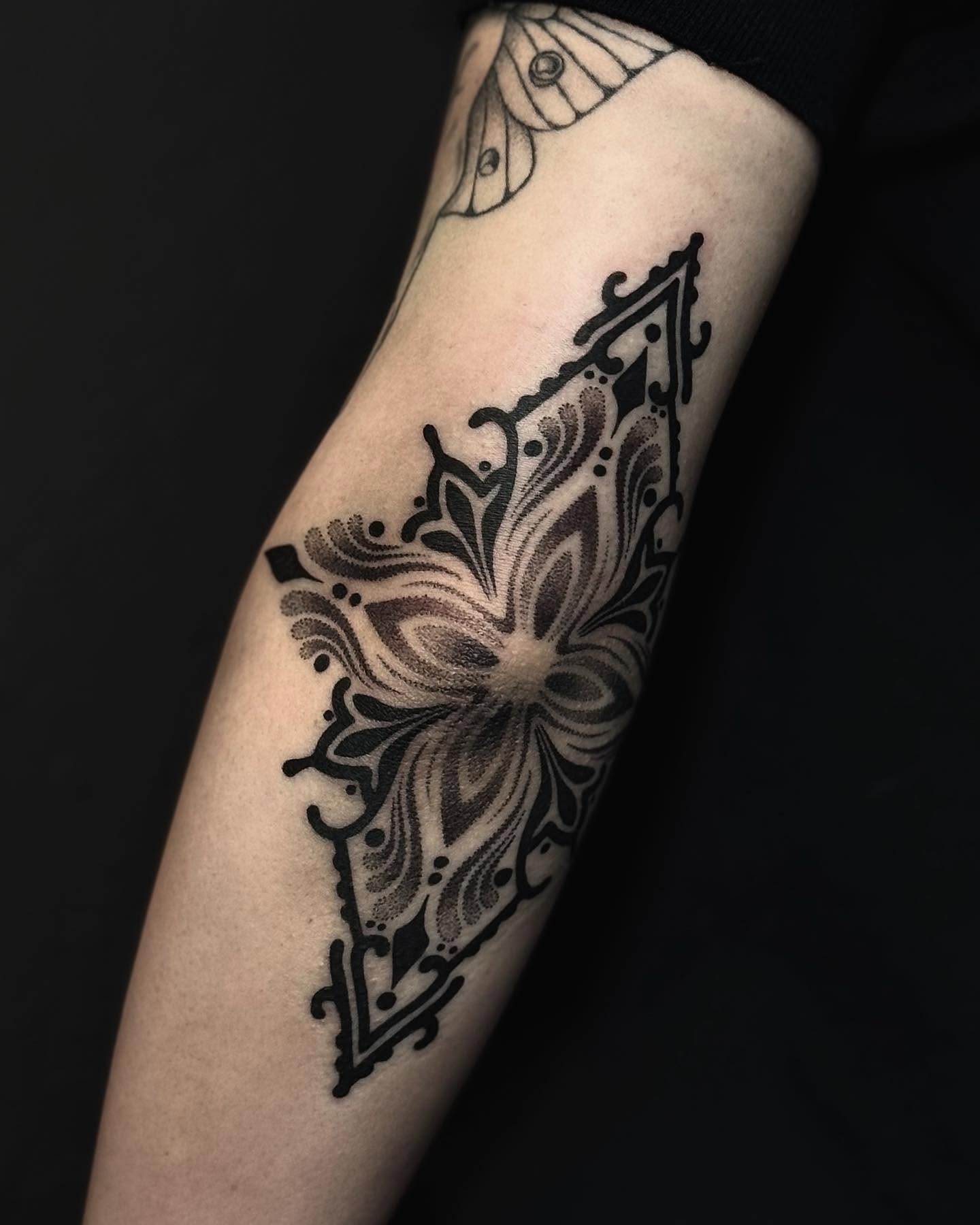 Floral design dotwork tattoo on the forearm by Taylor Elizabeth 🕉️