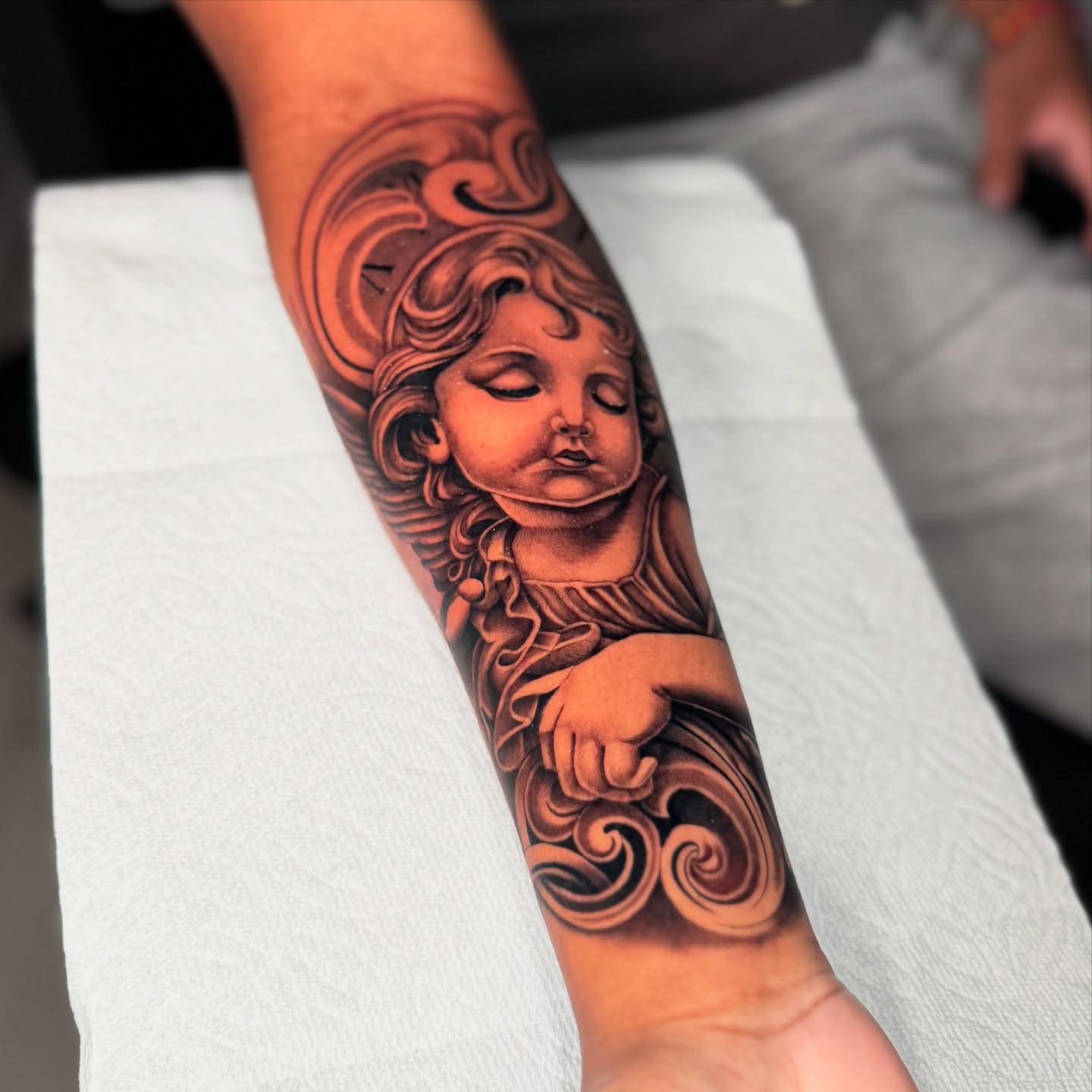 Angel realism tattoo on the forearm by Geo