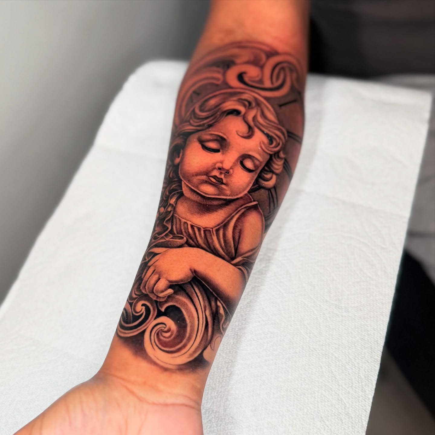 Angel realism tattoo on the forearm by Geo