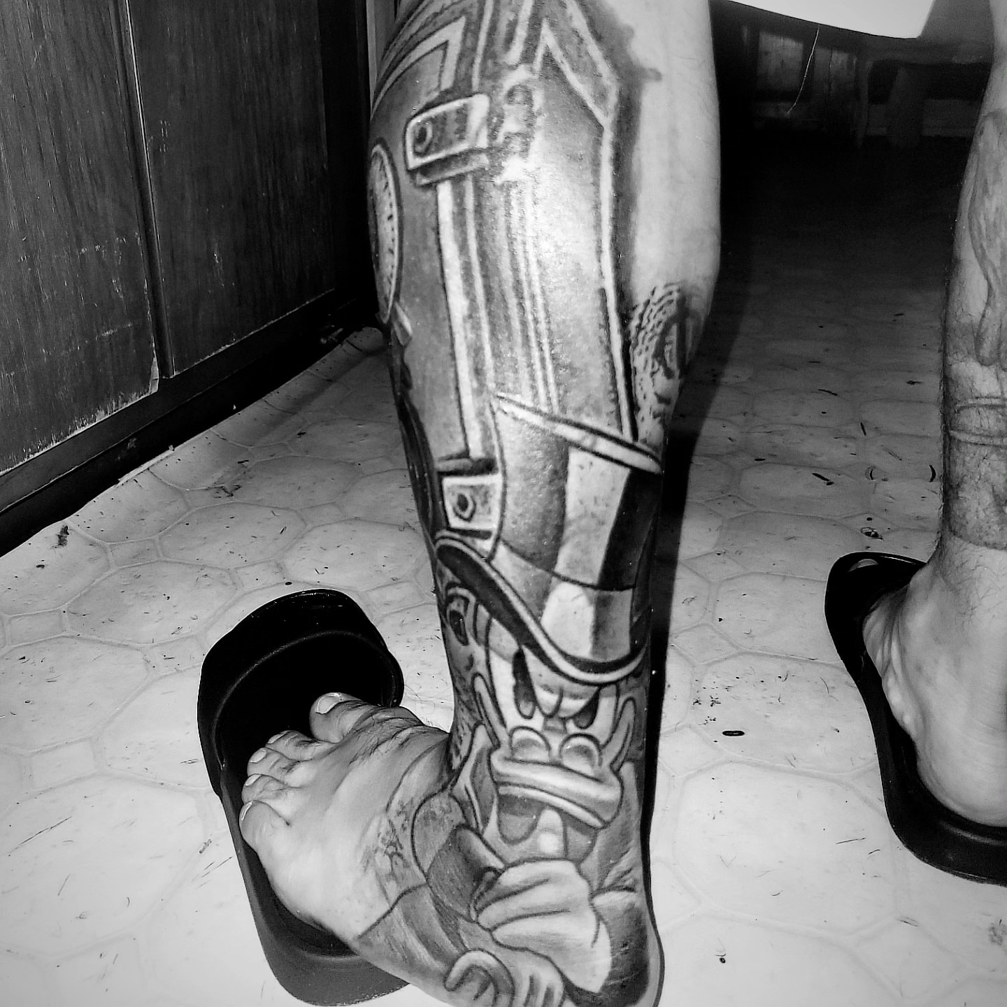 Mechanical armor realism tattoo on the calf by Beto Tats, Round Rock, Texas
