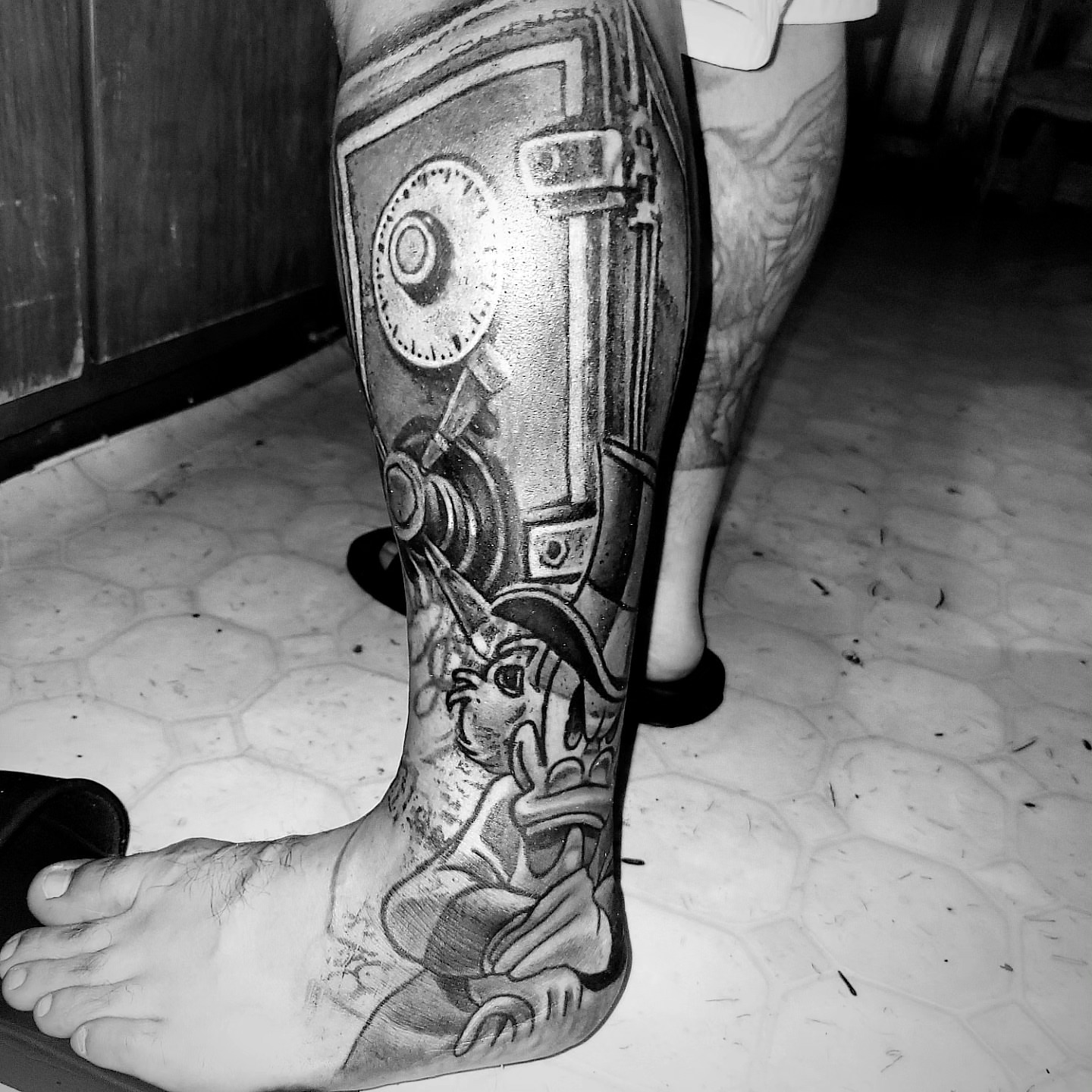 Mechanical gear geometric tattoo on the calf by Beto Tats, Round Rock, Texas