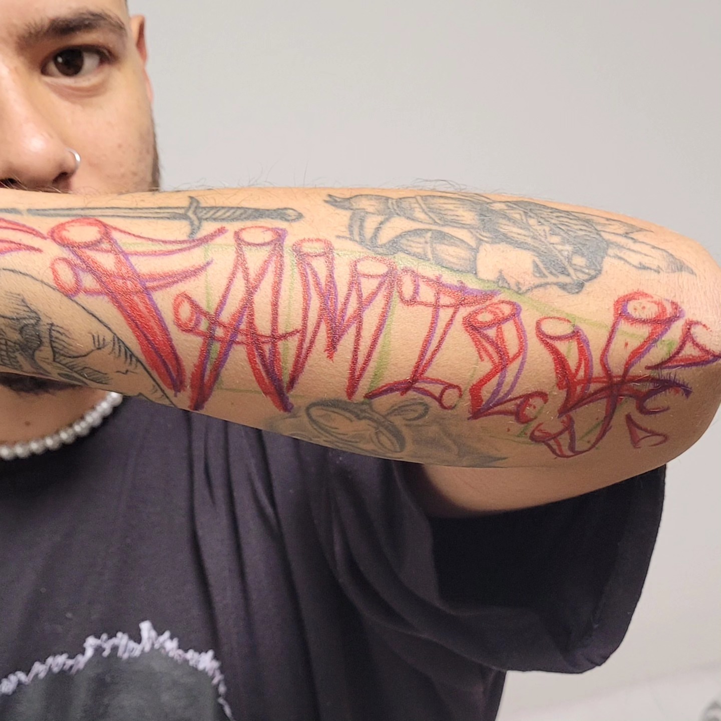 Graffiti-style lettering tattoo on the forearm by Gonzalo Pantona