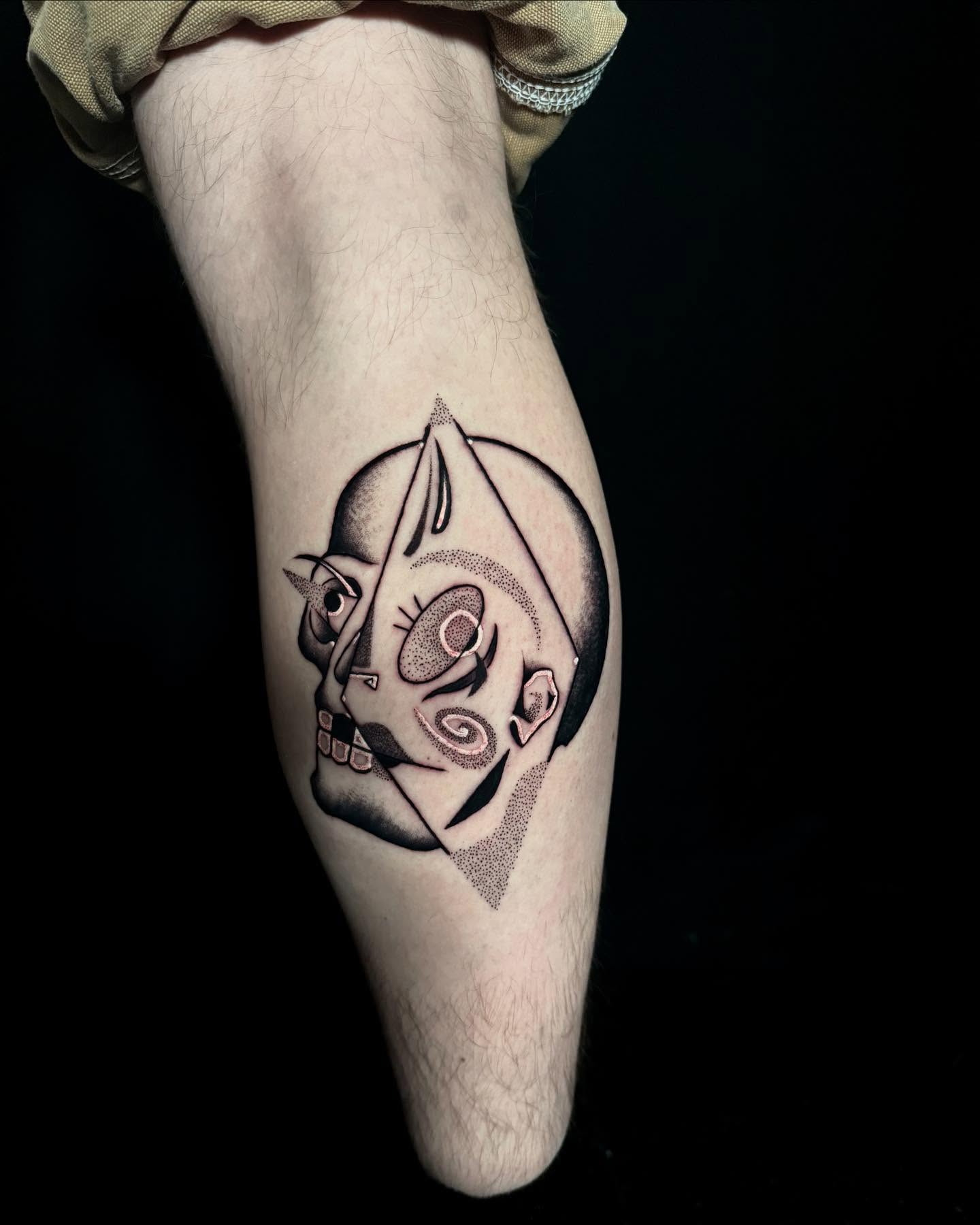 Abstract face dotwork tattoo on the forearm by Alex Richardson