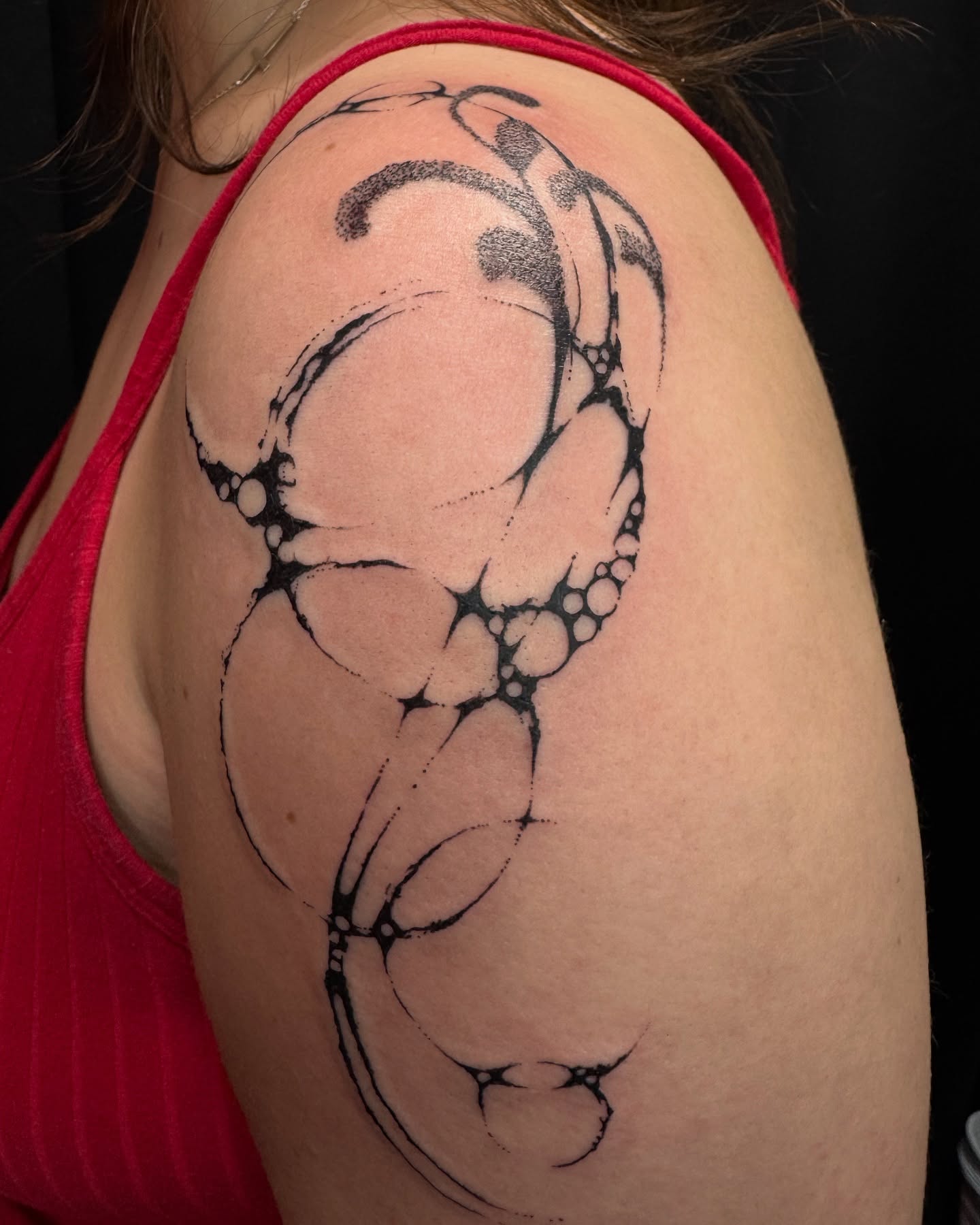 Abstract pattern dotwork tattoo on the shoulder by Milo