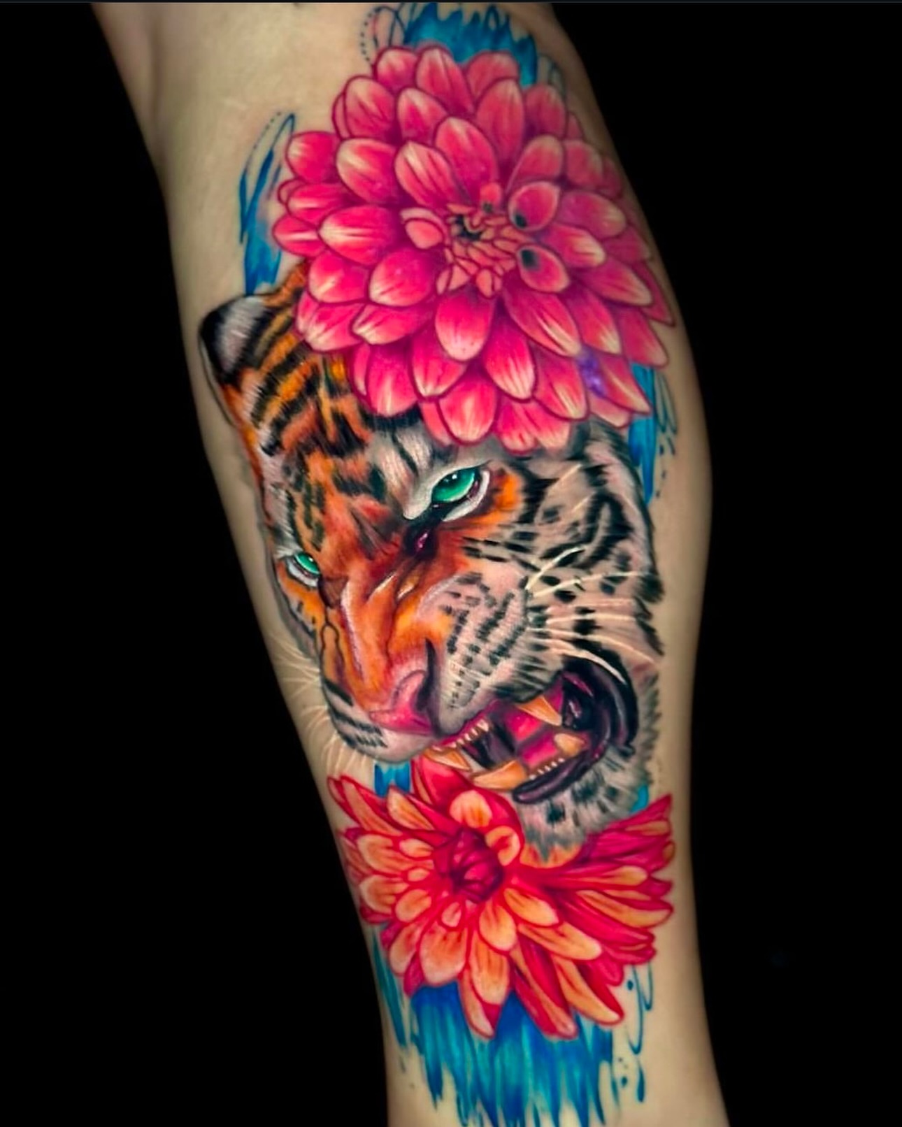 Tiger with flowers realism tattoo on the forearm by Goga