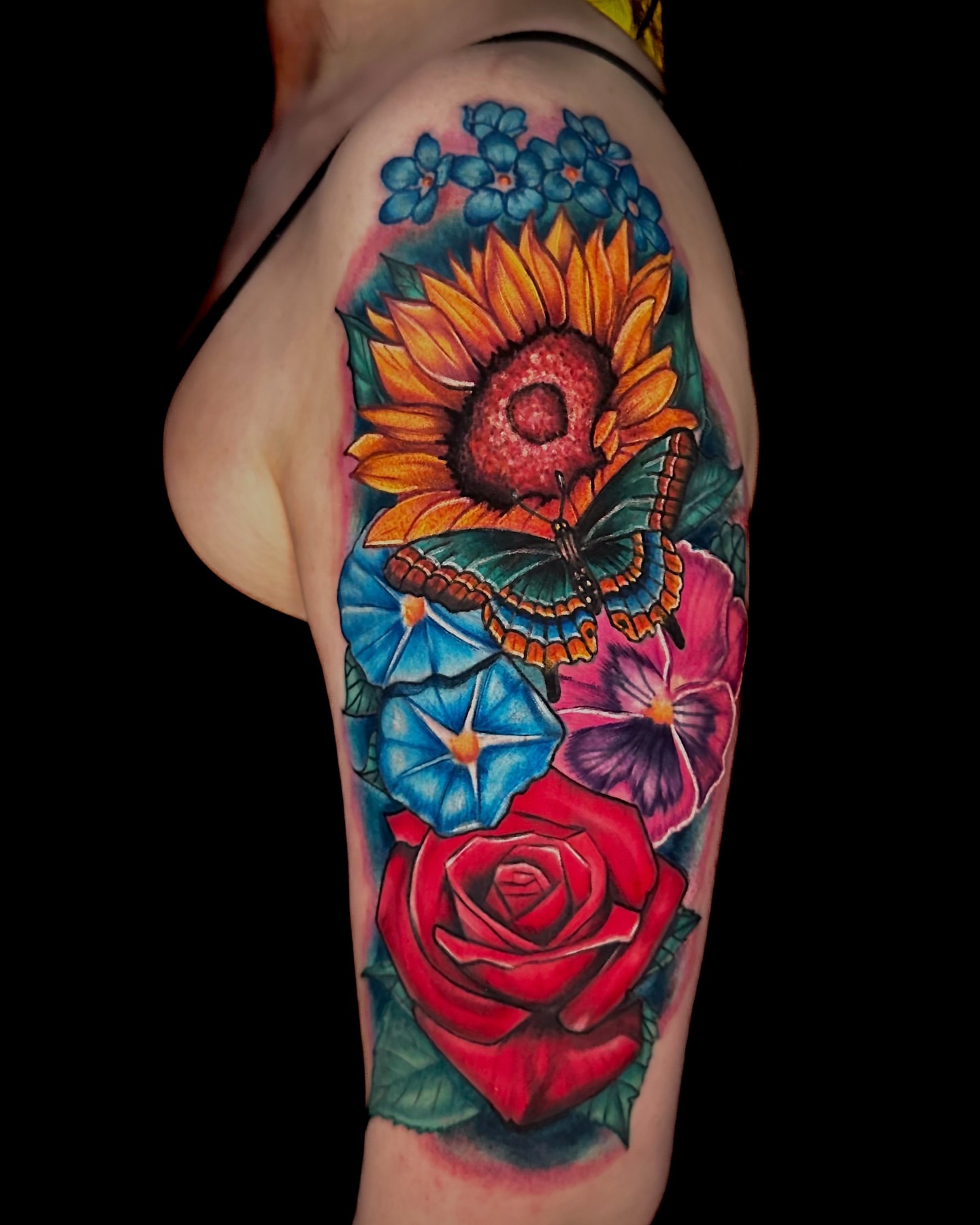 Sunflower and butterfly realism tattoo on the thigh by Goga