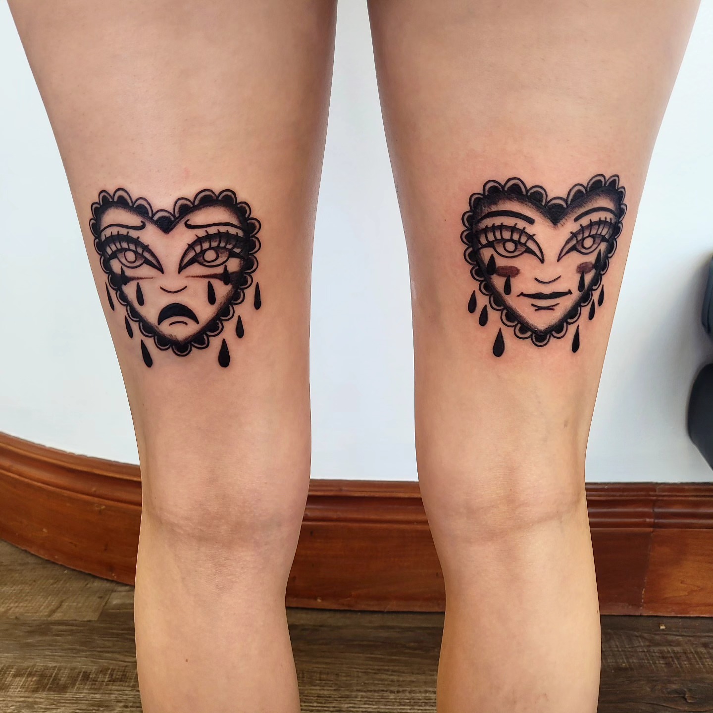Mask black and grey tattoo on the thigh by Wray Saulsberry