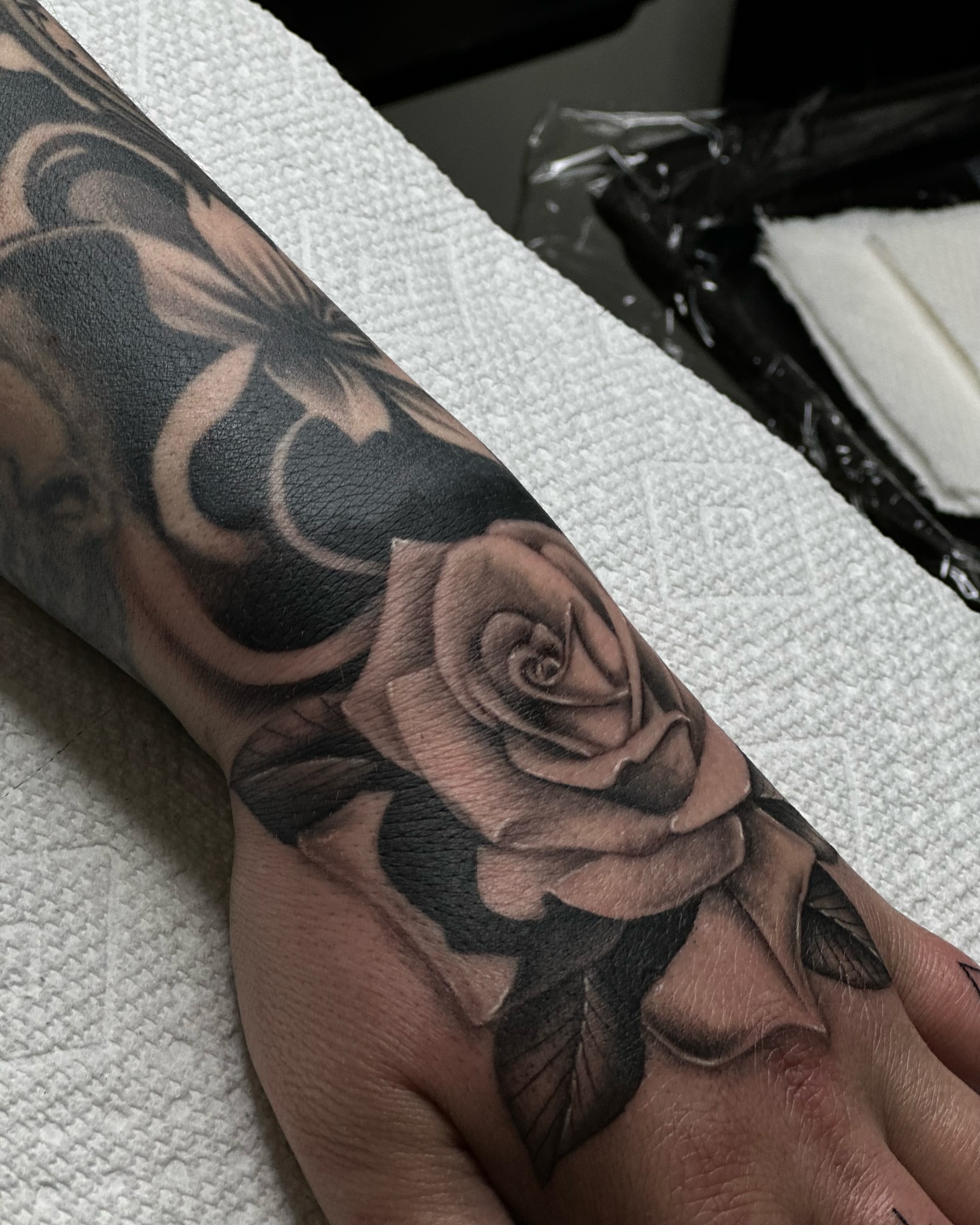 Rose realism tattoo on the forearm by Iryna Polyakhova