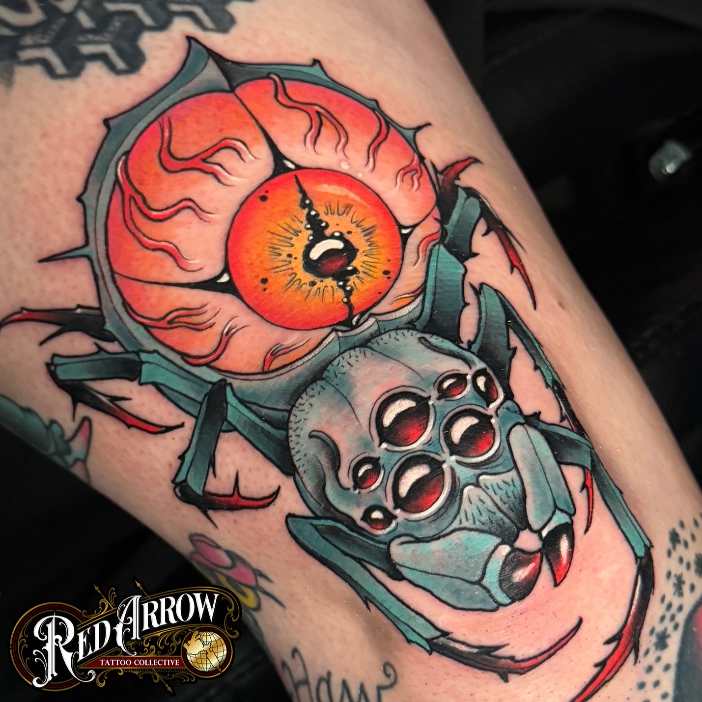 Eye and beetle American traditional tattoo on the thigh by 𝕽𝖊𝖉 𝕬𝖗𝖗𝖔𝖜 𝕿𝖆𝖙𝖙𝖔𝖔 𝕮𝖔𝖑𝖑𝖊𝖈𝖙𝖎𝖛𝖊, Troy, Michigan