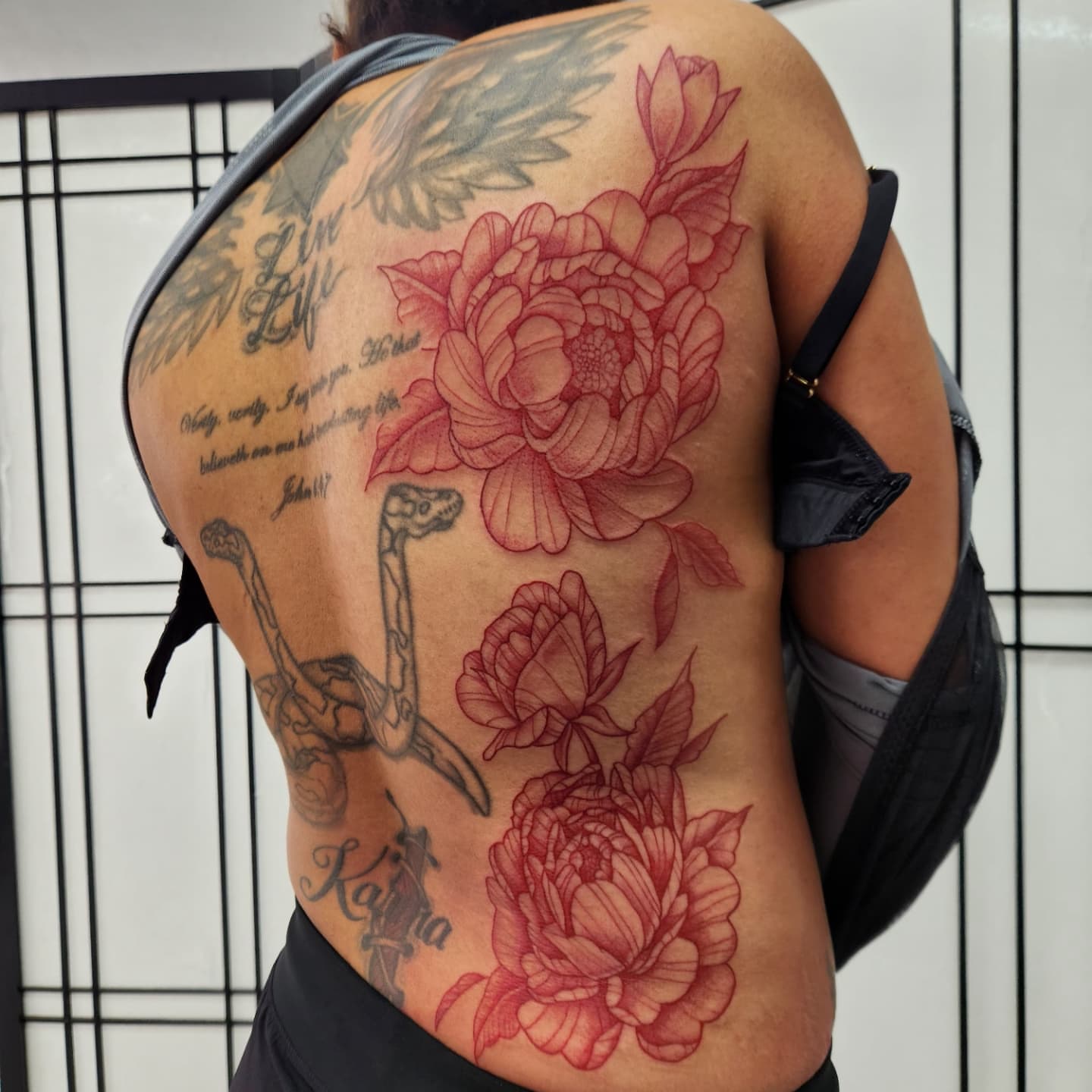 Peony flowers realism tattoo on the back by Elizabeth Stepp