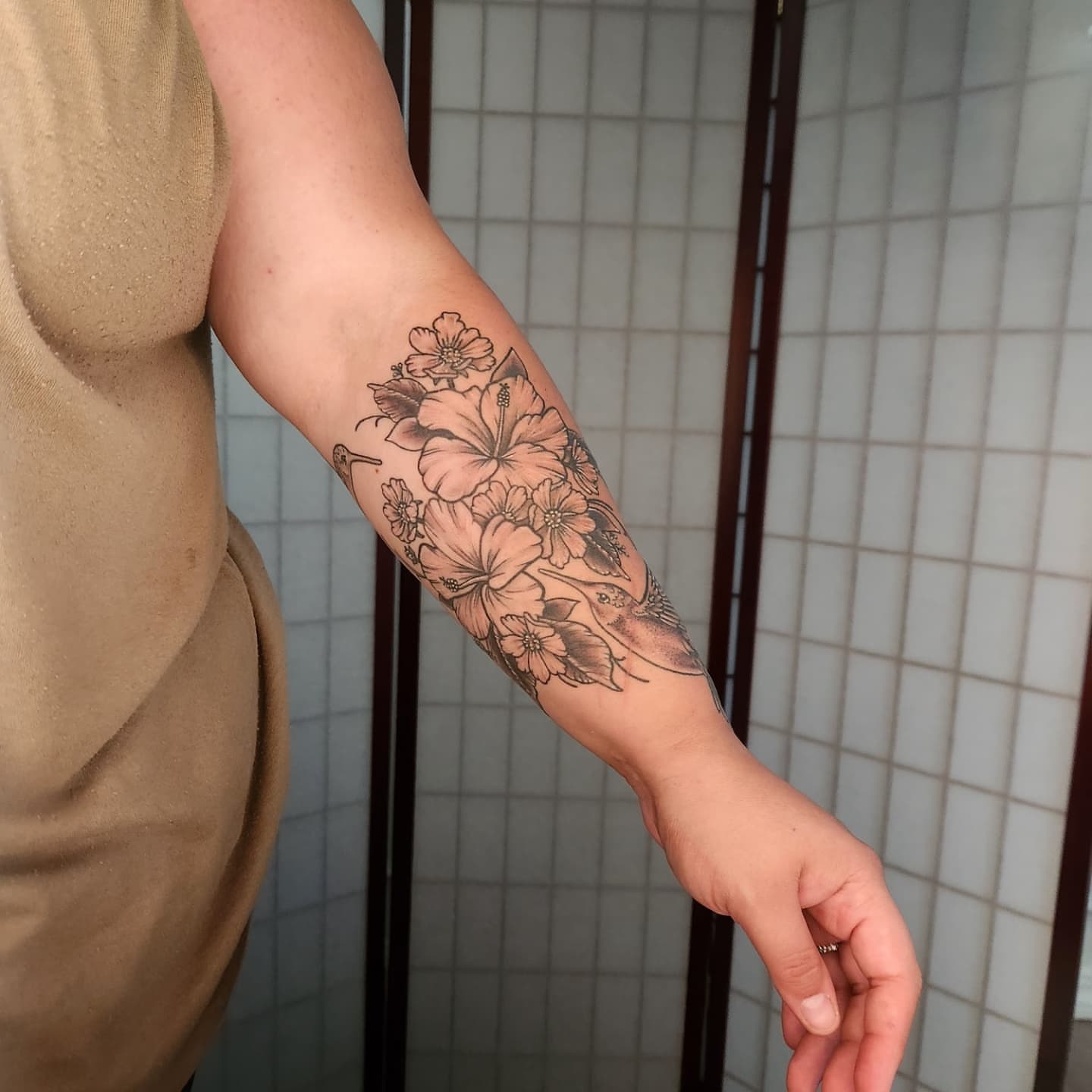 Floral bouquet black and grey tattoo on the forearm by Elizabeth Stepp