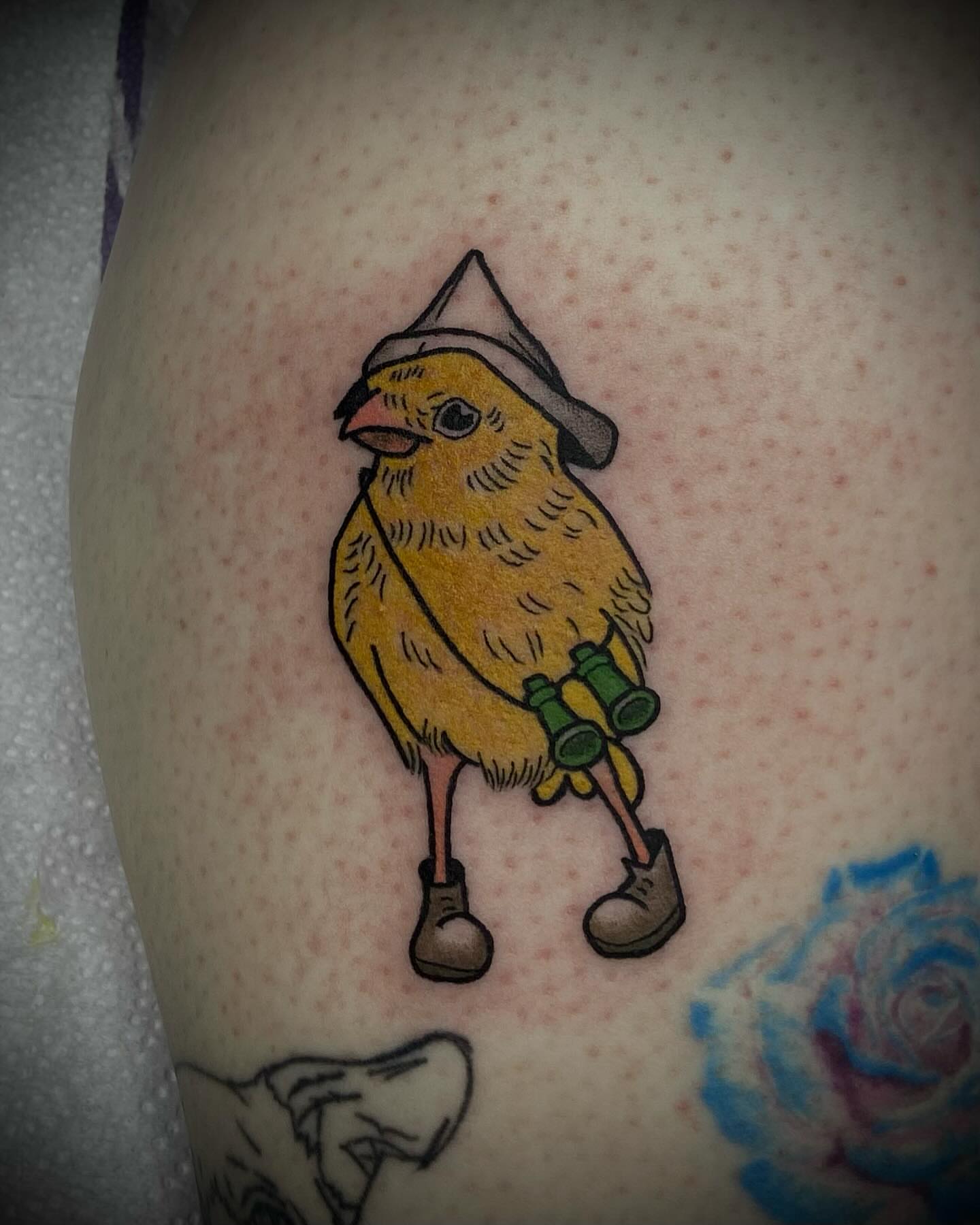 Bird with binoculars illustrative tattoo on the thigh by Shelbie, Salt Lake City, Utah