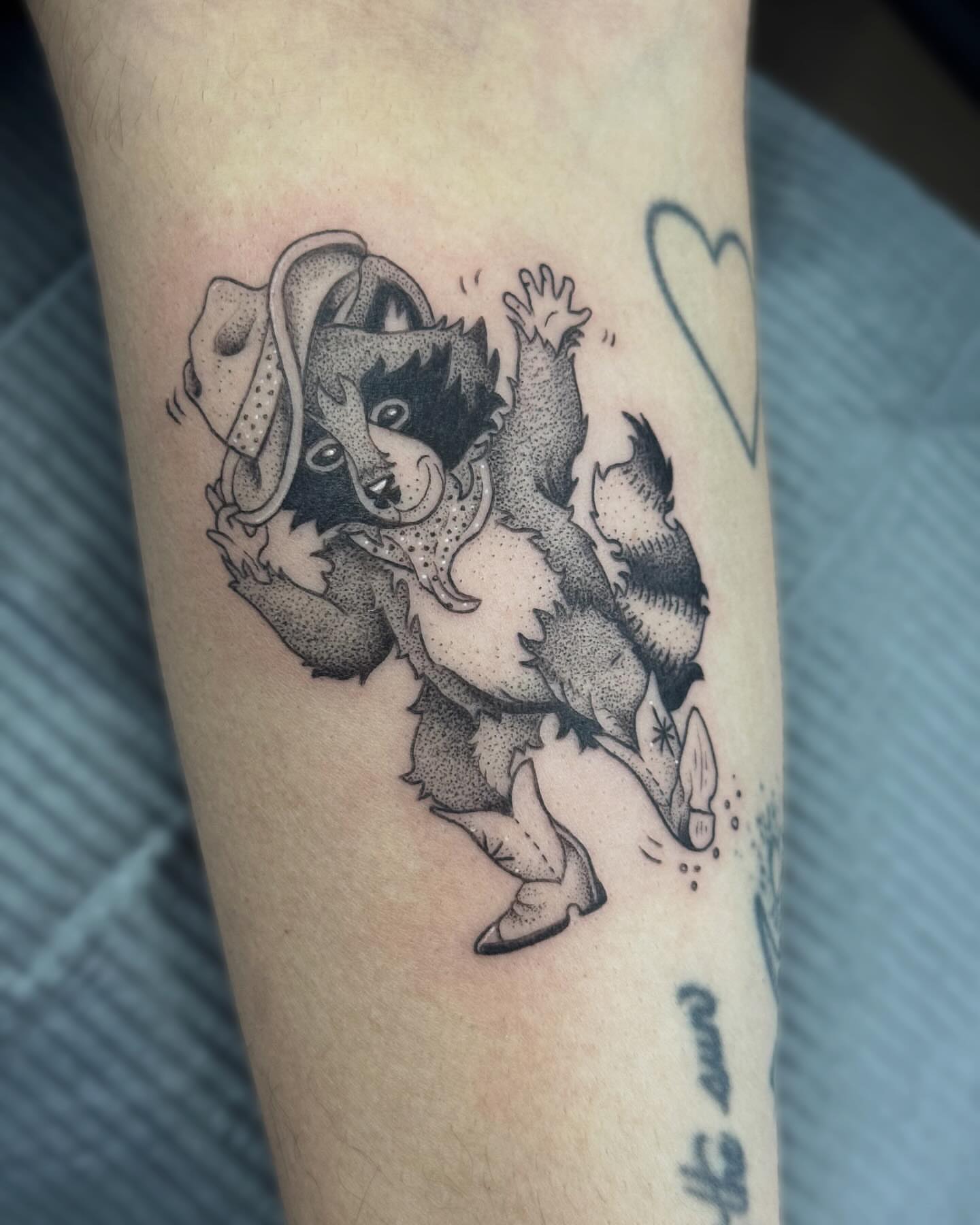 Dog dancing dotwork tattoo on the forearm by Writhe Grey
