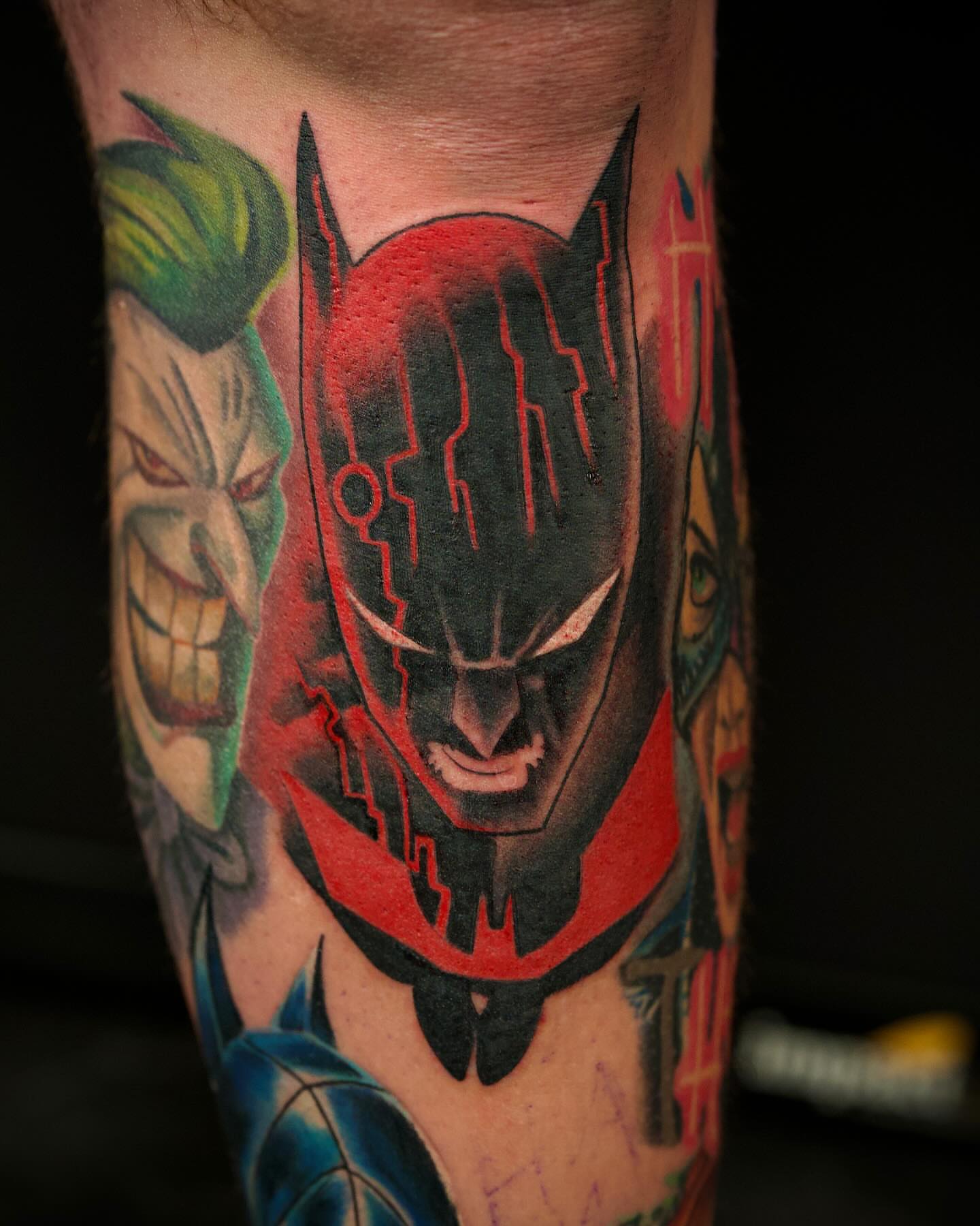 Batman dark realism tattoo on the forearm by Chris Lochbihler