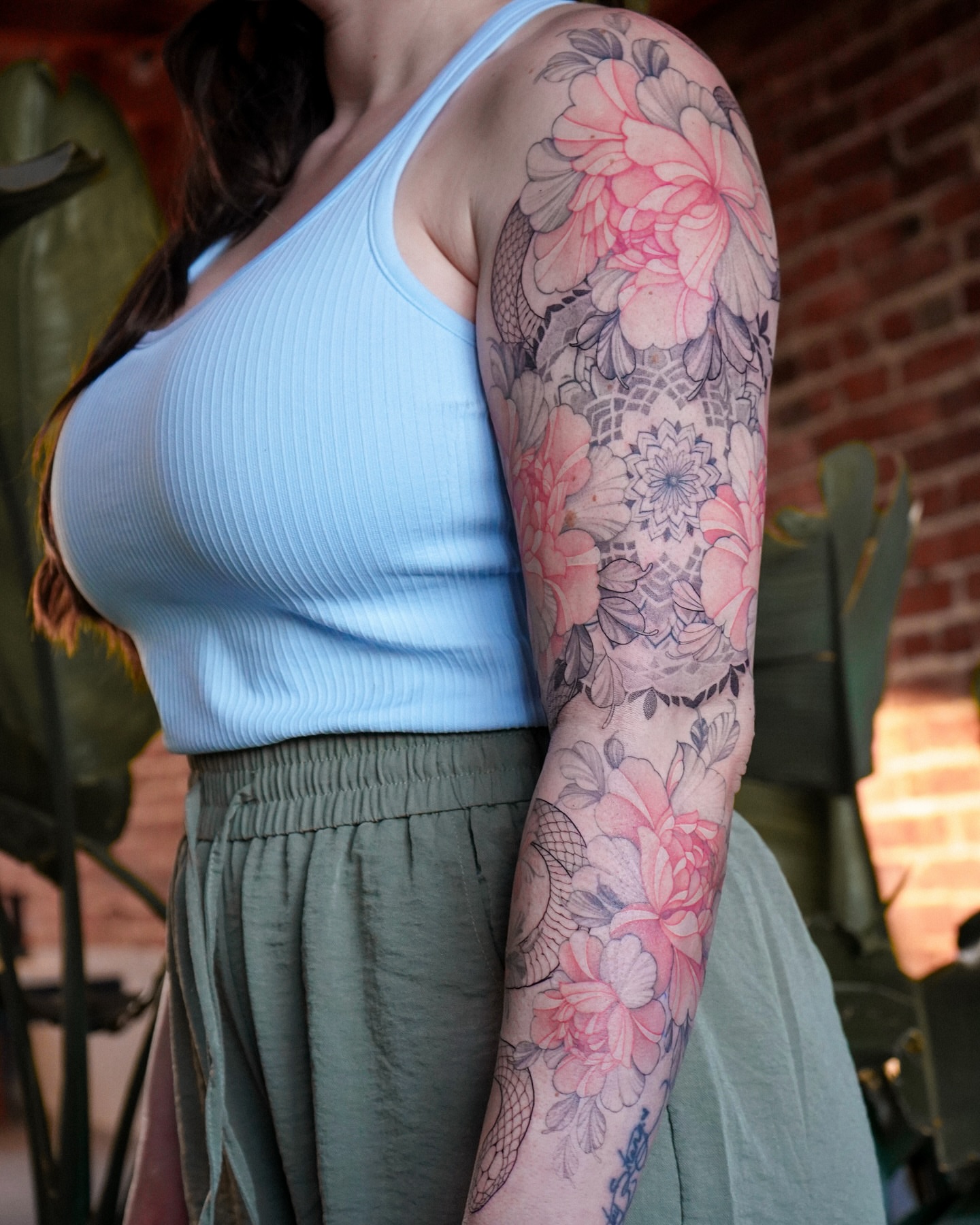 Floral bouquet new school tattoo on the upper arm by Flower Tattoo Sf