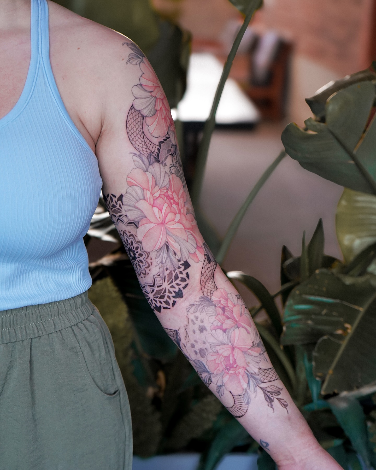 Floral bouquet watercolor tattoo on the forearm by Flower Tattoo Sf