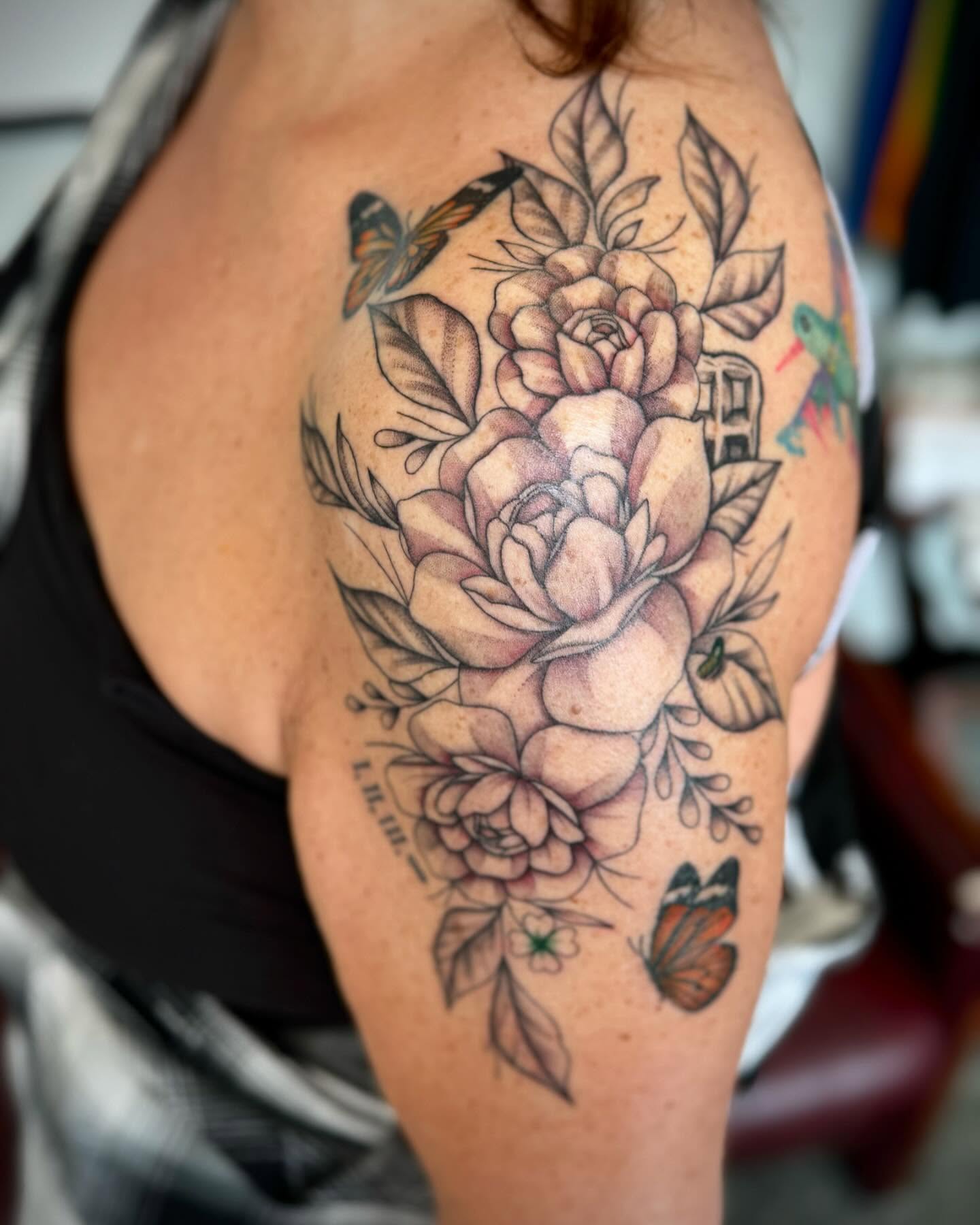 Flowers and butterflies realism tattoo on the shoulder by oh hey, robin.