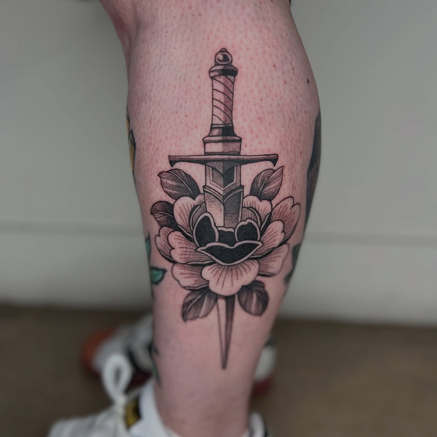Sword and flower American traditional tattoo on the calf by 🥀michael Ta 🥀
