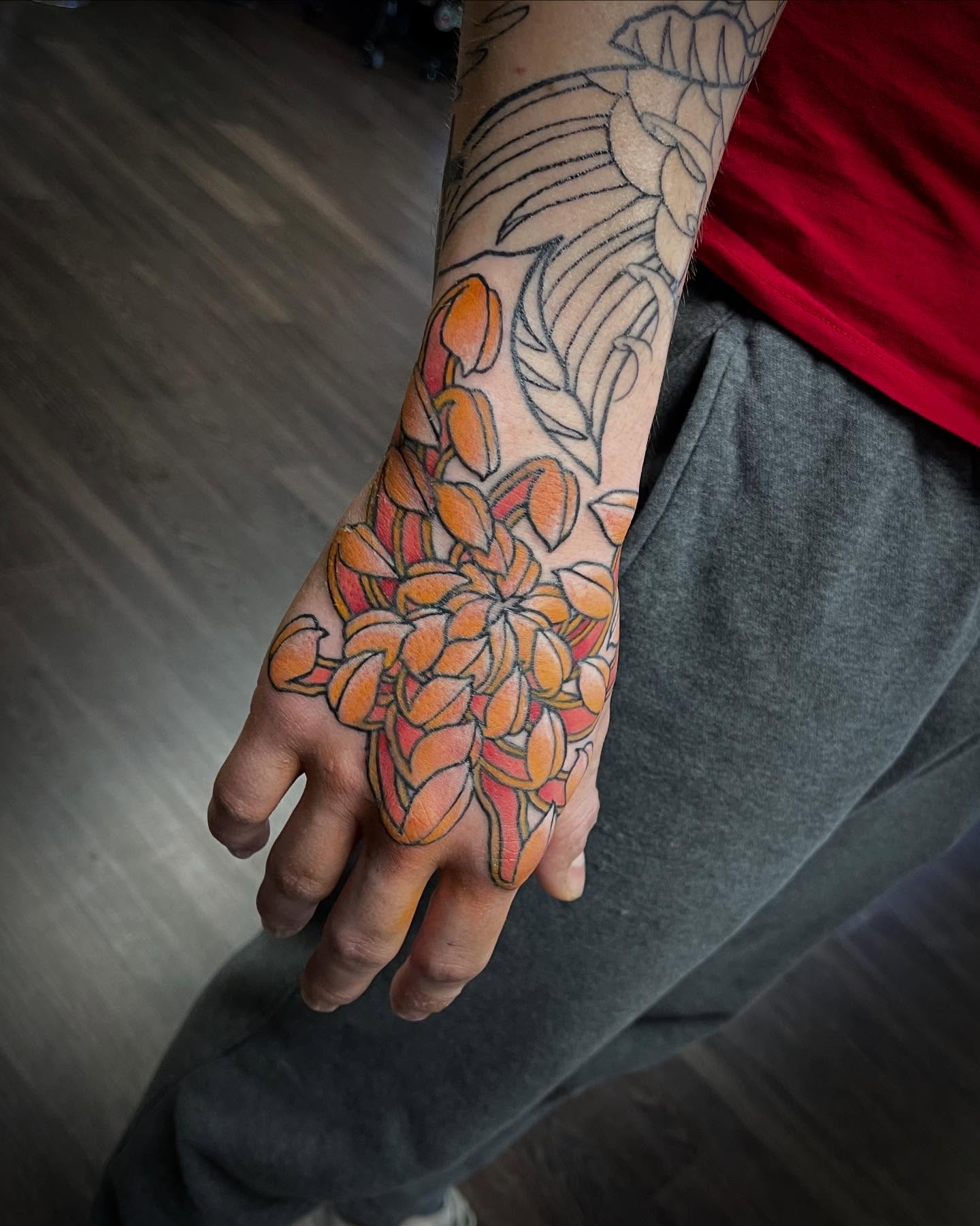 Floral arrangement new school tattoo on the hand by Jaxson Eugene Brady-Hobart