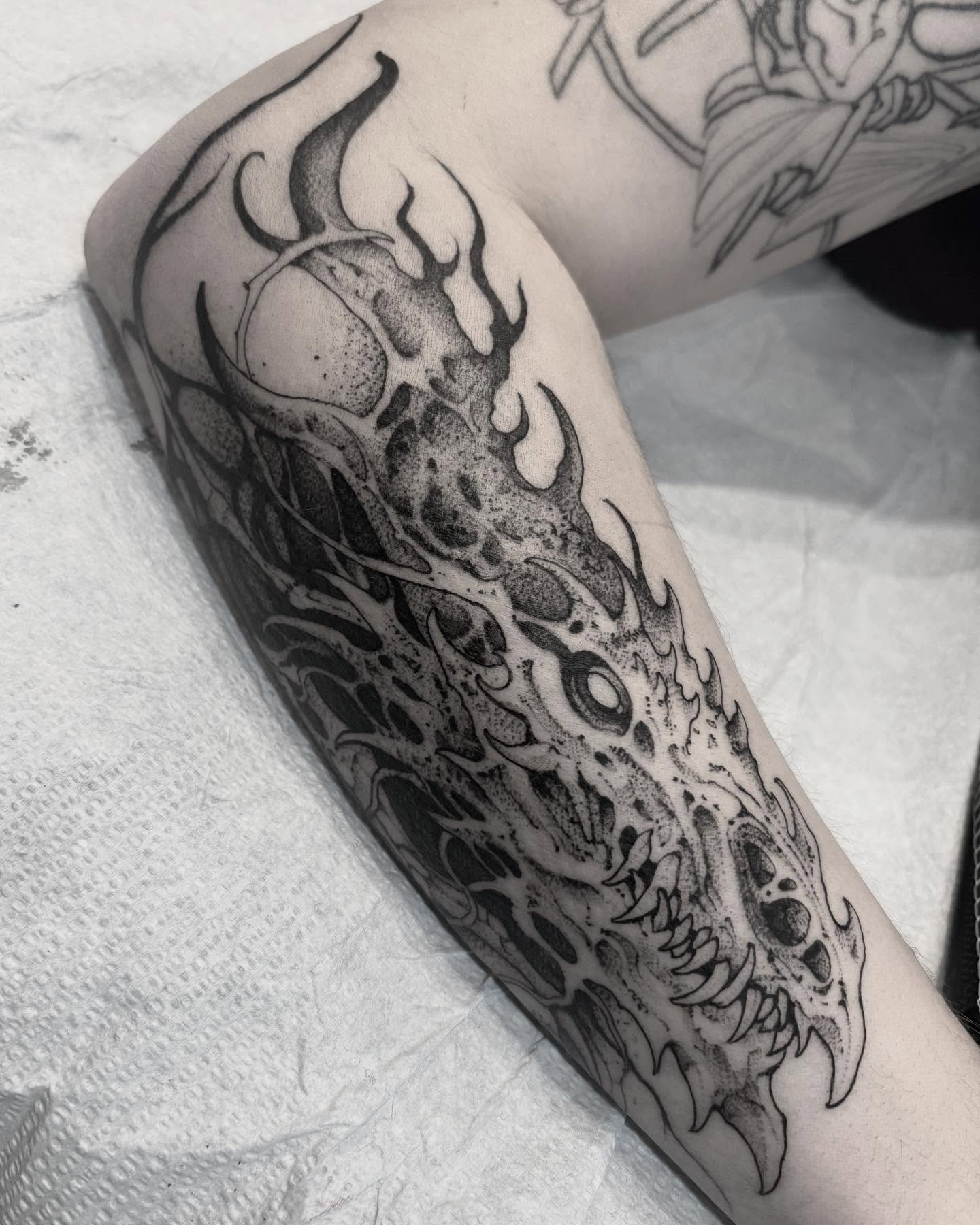 Dragon skull dotwork tattoo on the forearm by Becci Chelicerata