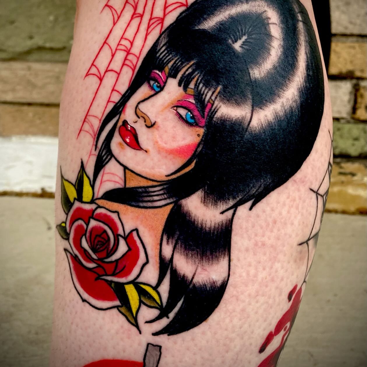 Woman with roses American traditional tattoo on the forearm by Julie Bird