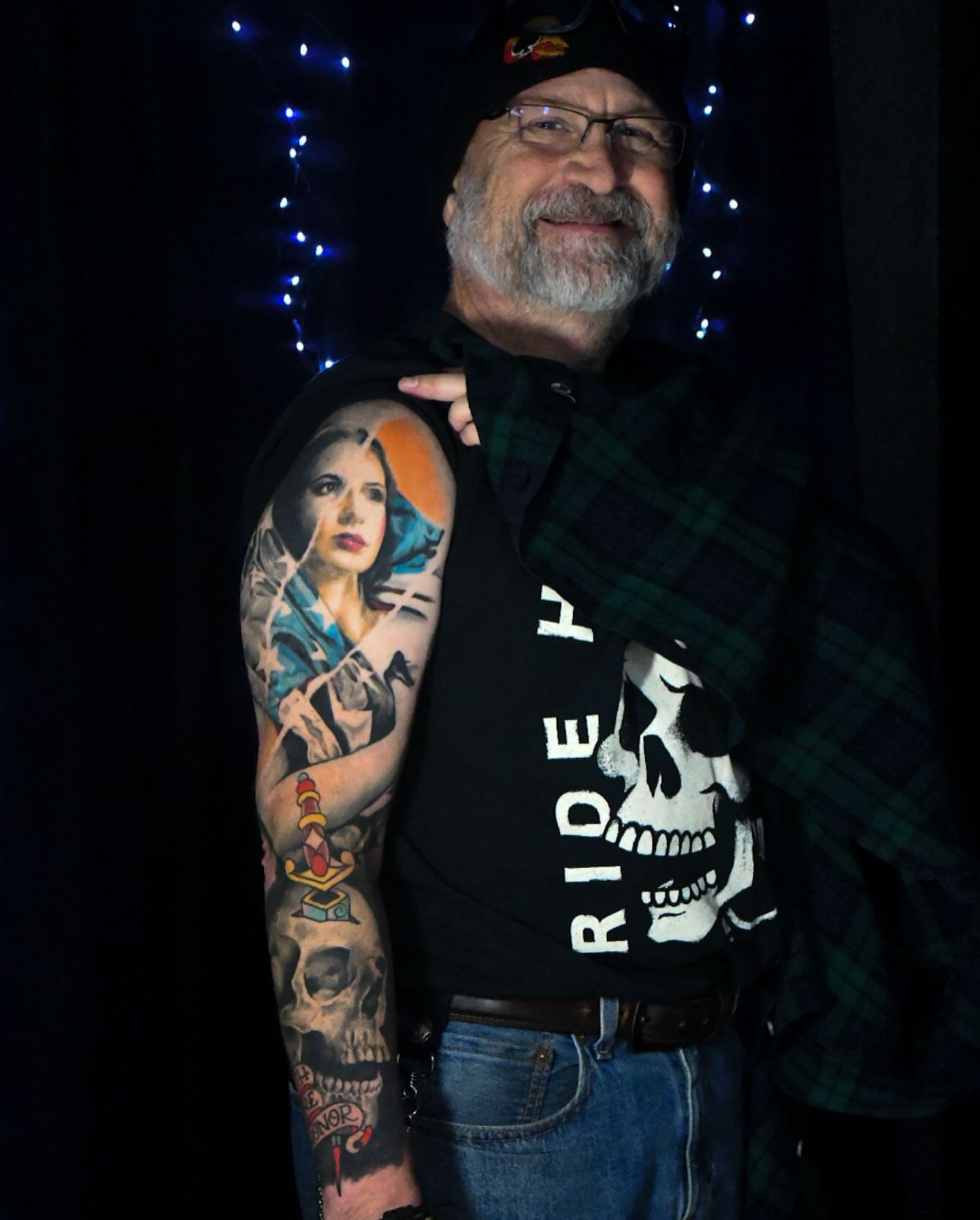 Woman with violin realism tattoo on the upper arm by Travis Thorpe