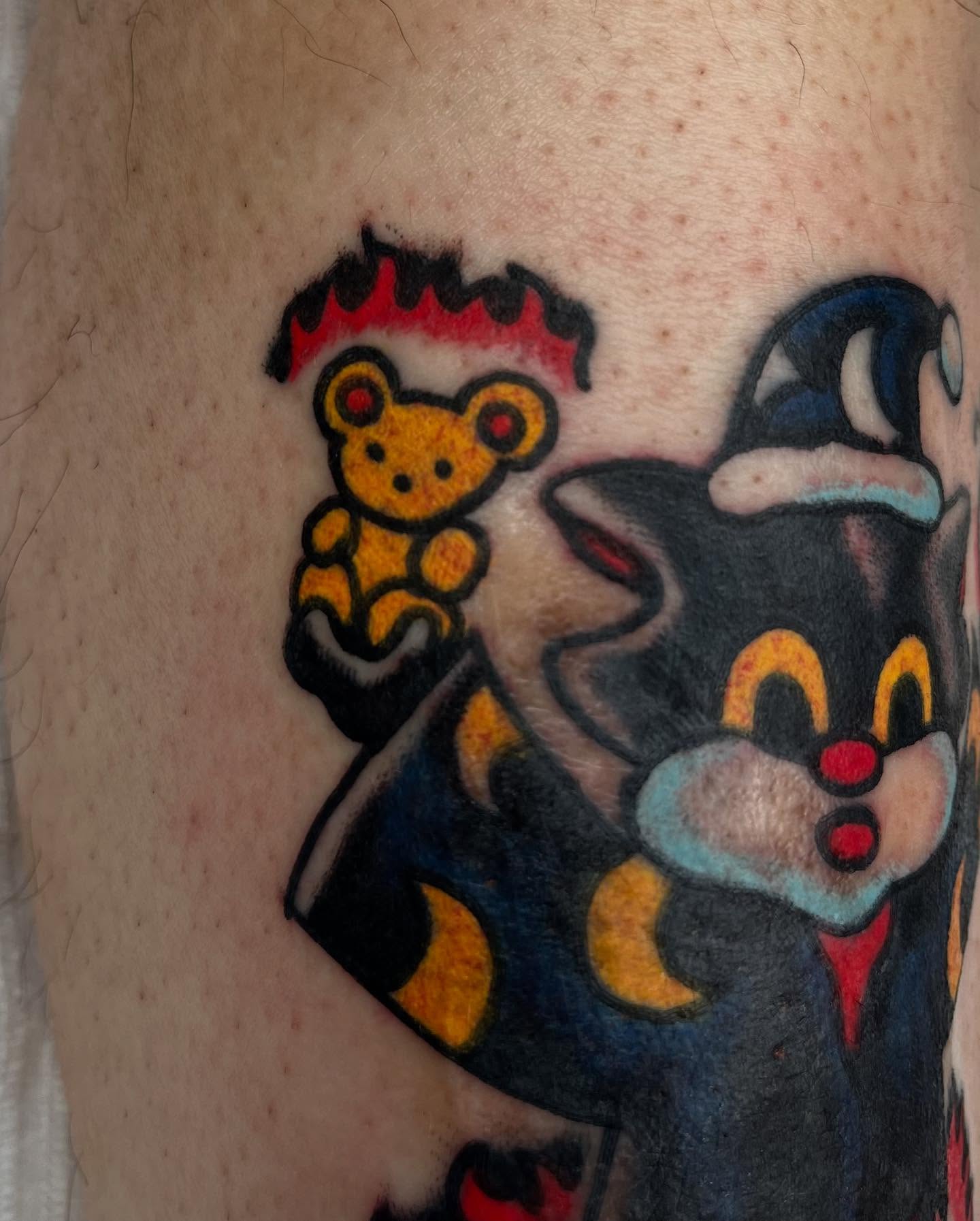 Tom and jerry American traditional tattoo on the forearm by Jimmy Ho