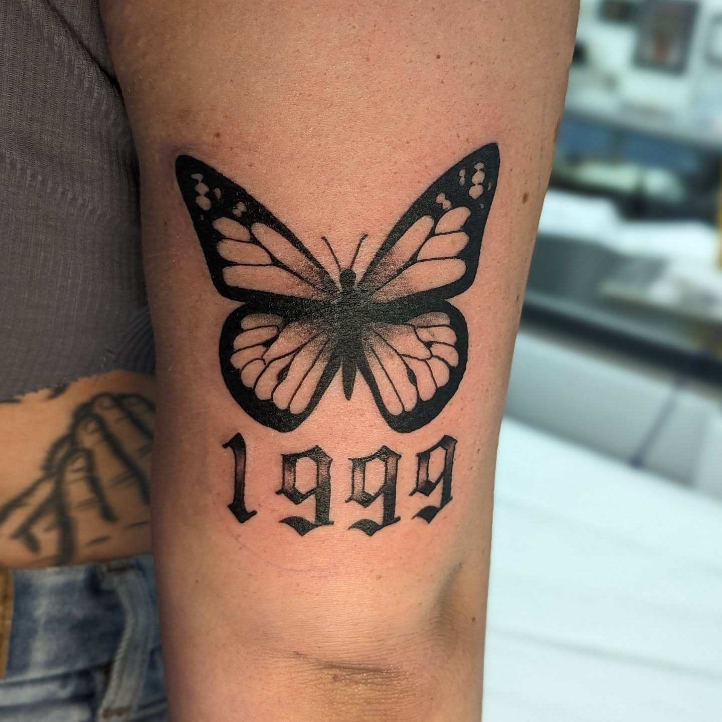Butterfly black and grey tattoo on the forearm by DONEL 📍Denver