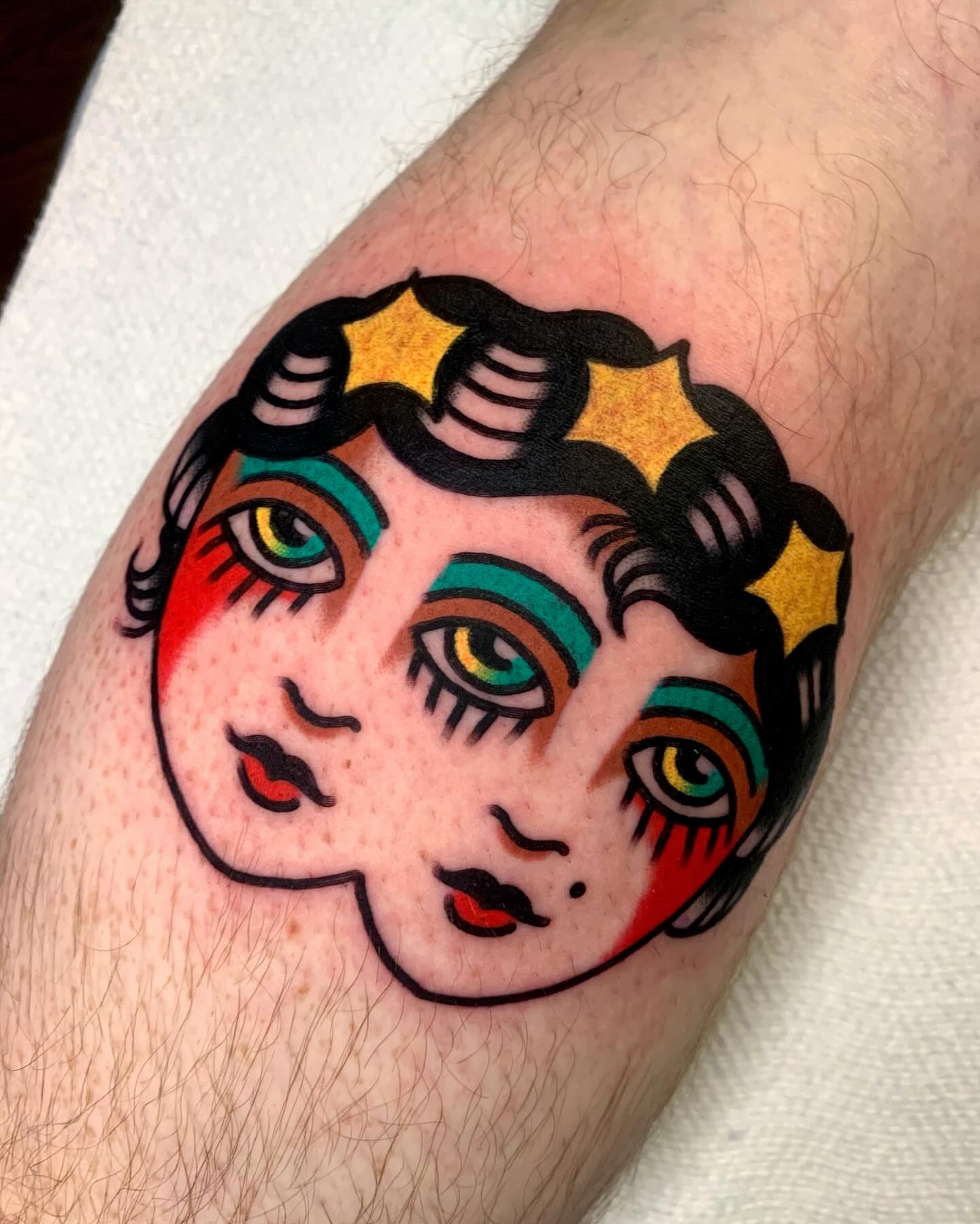 Female face American traditional tattoo on the forearm by Shawn VanKirk