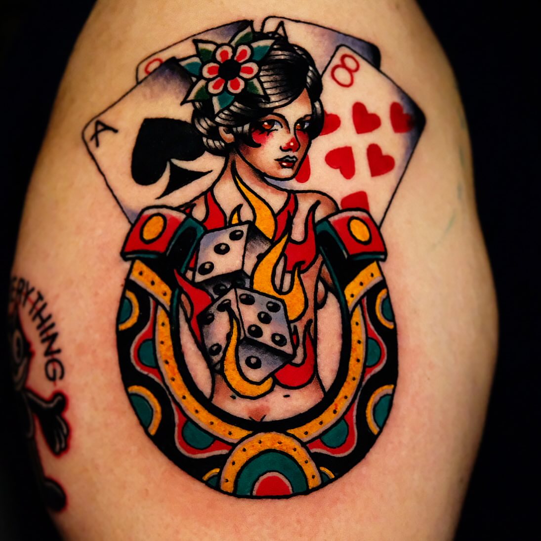 Geisha with playing cards American traditional tattoo on the shoulder by Don Boos Tattoos