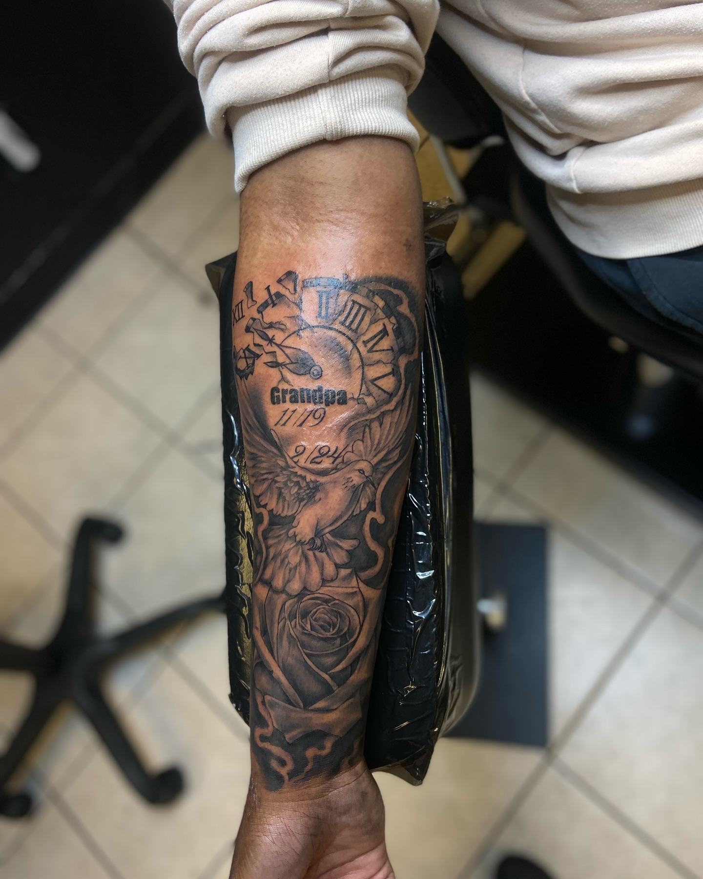 Clock and eagle black and grey tattoo on the forearm by Chicago Tattoo Artist