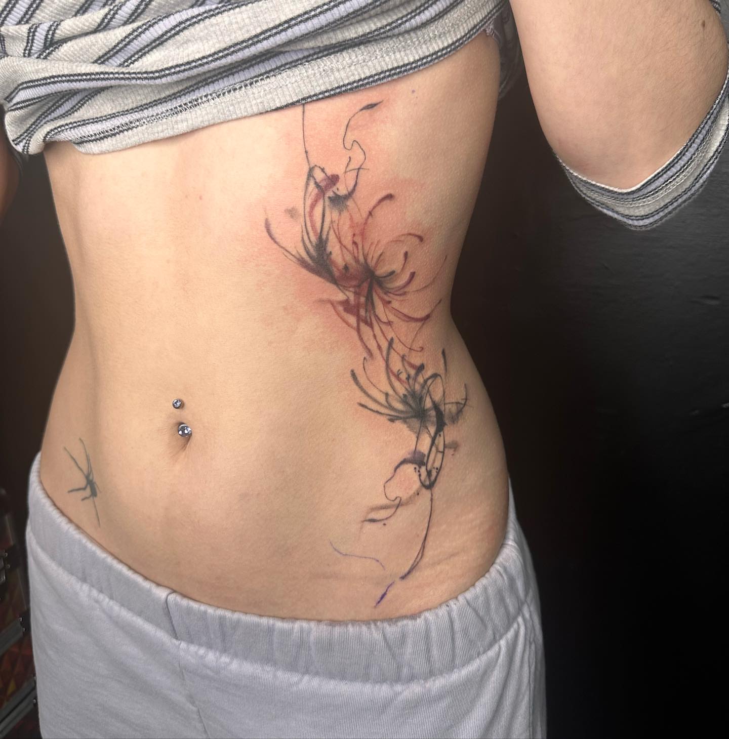 Abstract floral design watercolor tattoo on the torso by Kat π