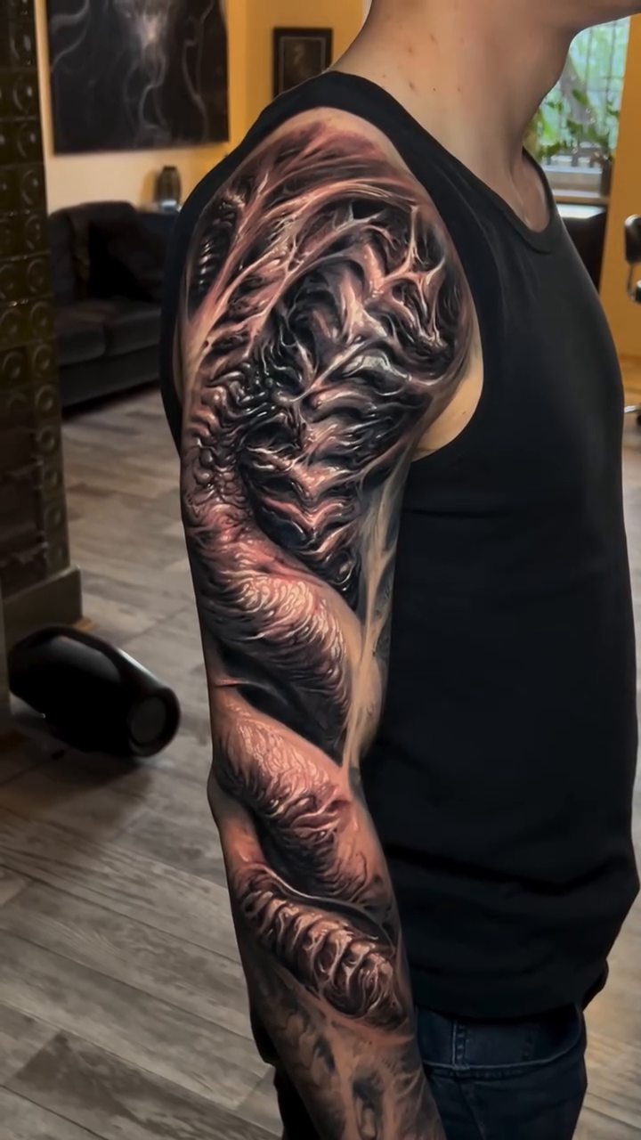 Biomechanical creature realism tattoo by David Jorquera